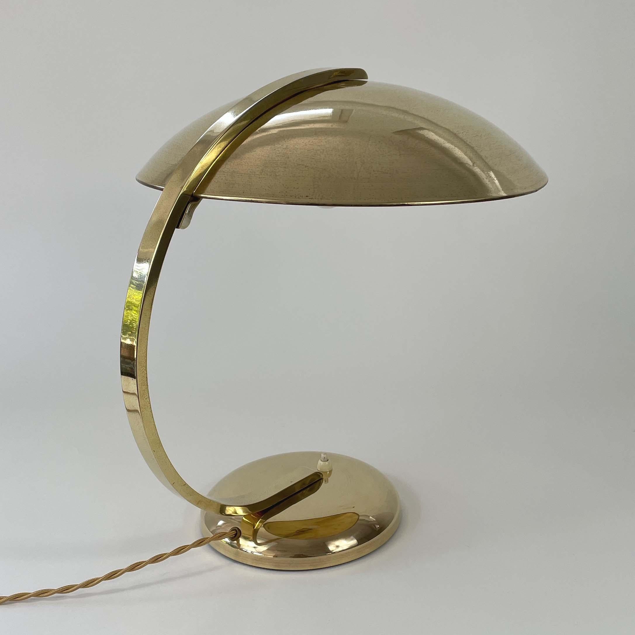 This vintage large original Hillebrand brass desk lamp was designed and manufactured in Germany in the 1930s. Typical streamline design and heavy quality. 

The lamp works with an E27 Edison screw on bulb on 220V as well as 110V. It has been rewired