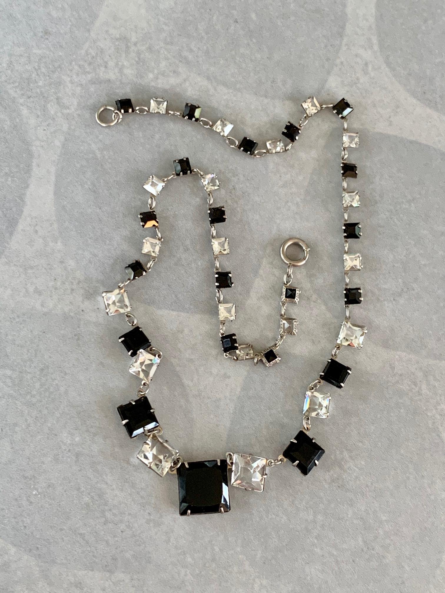 This Art Deco style Station necklace features square mounted black and clear Crystal squares set in decorative sterling silver mounts. 