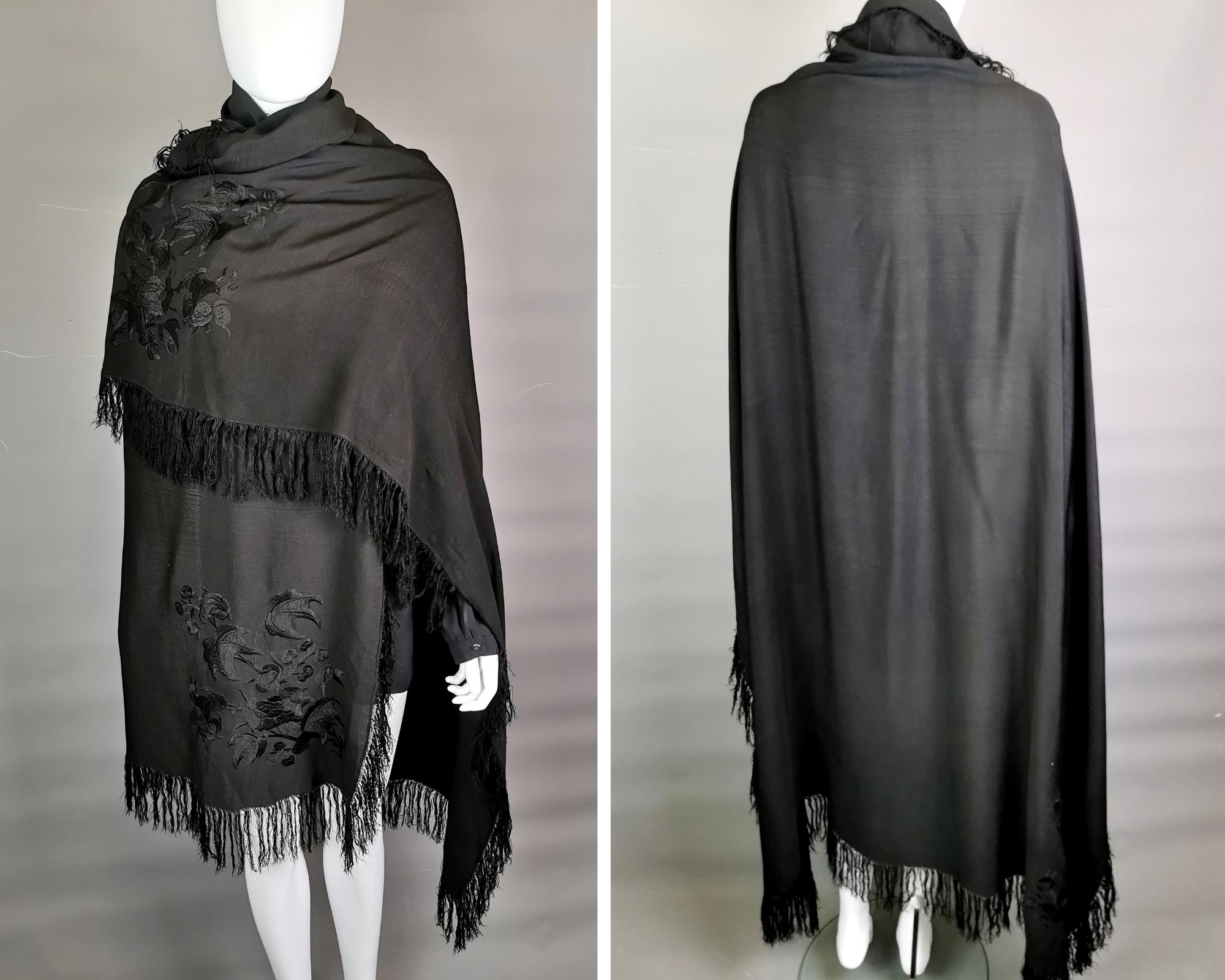 A gorgeous vintage, Art Deco era large crepe silk shawl.

It is a nice rich black colour with a small tassled fringe, the alternate corners have a large embroidered floral design.

It is a large size, very versatile and can be worn many