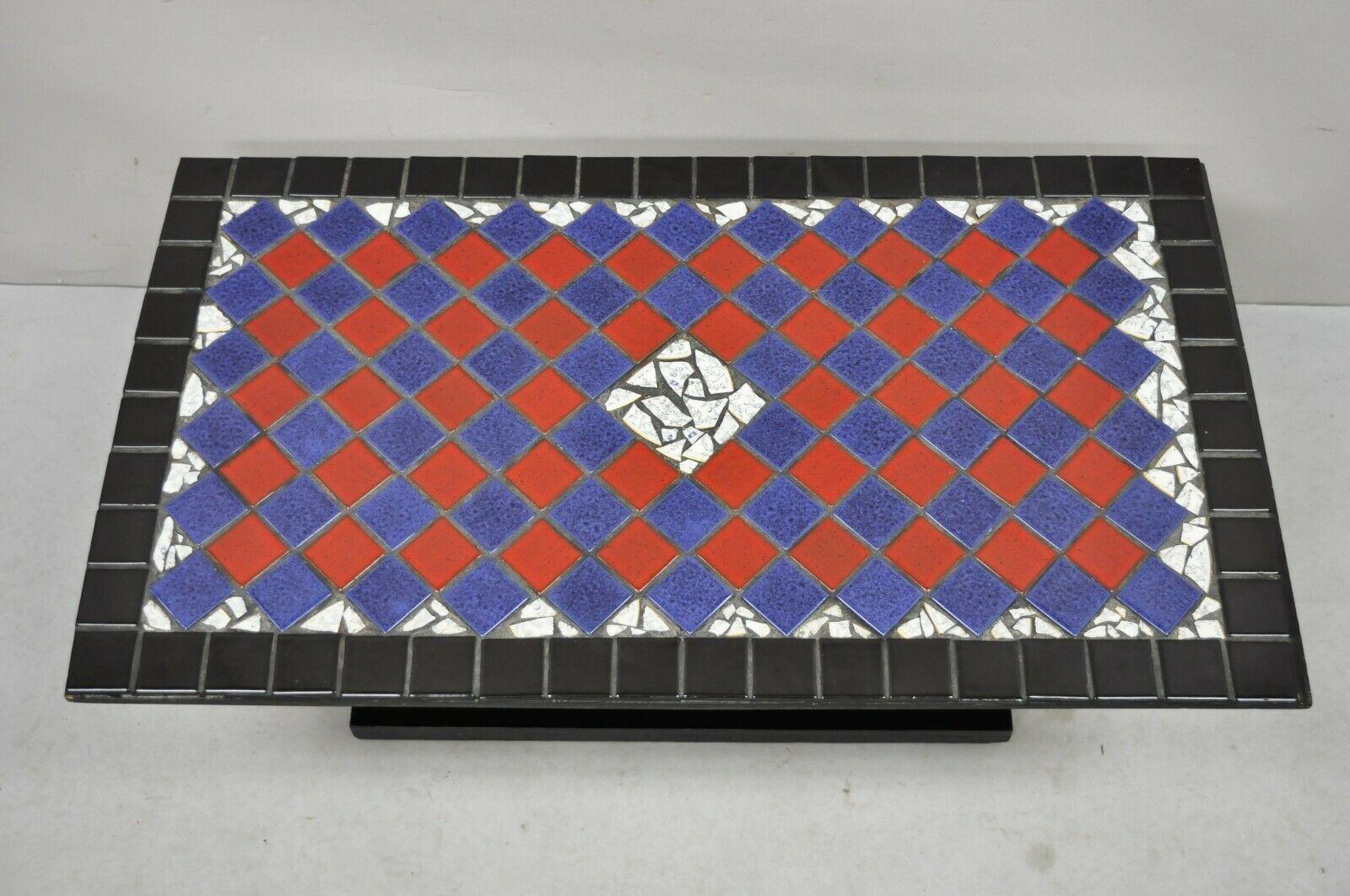 Vintage Art Deco blue and red Mosaic Tile Top Arch base coffee table. Item features a mosaic porcelain and ceramic tile top, arched pedestal base, very vintage item, great style and form. Circa Early to Mid 1900s. Measurements: 13.5