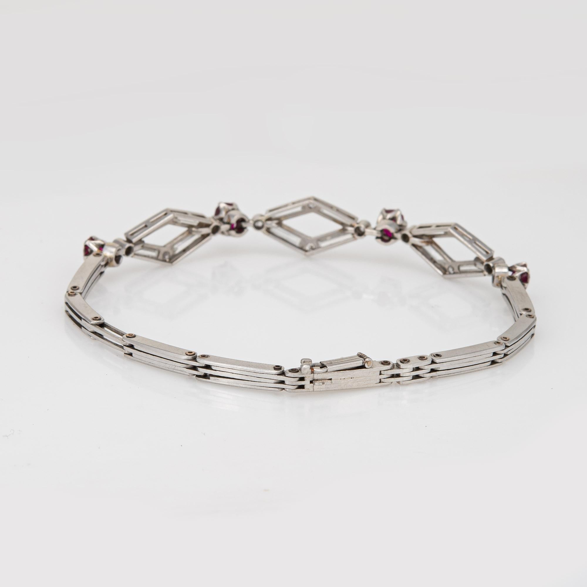 Finely detailed vintage Art Deco era ruby & diamond bracelet crafted in 900 platinum (circa 1920s to 1930s).  

Straight baguette & old european cut diamonds total an estimated 1.20 carats (estimated at H-I color and VS2-SI1 clarity). Four rubies