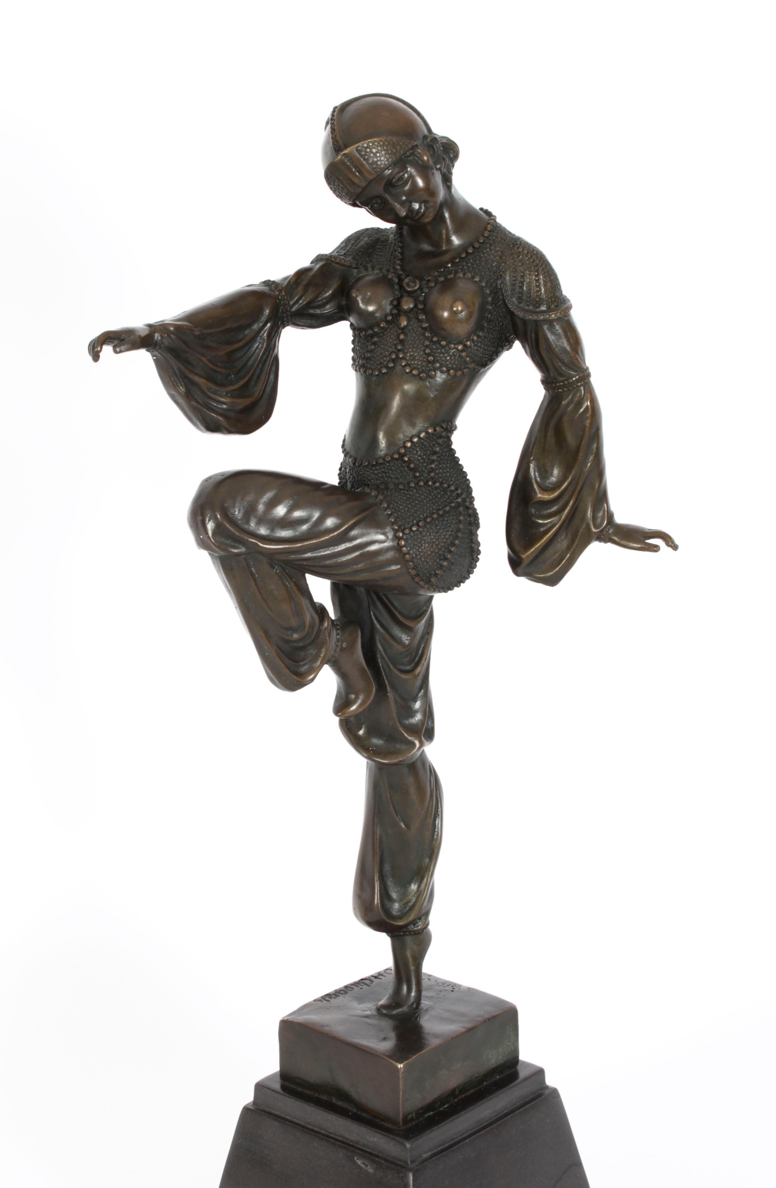 This is an eye-catching Vintage Art Deco Revival bronze dancing girl dating from the mid 20th century.

This beautiful piece is a 20th Century recast of a sculpture created by the famous Romanian sculptor Demetre Chiparus.

Made by the classical