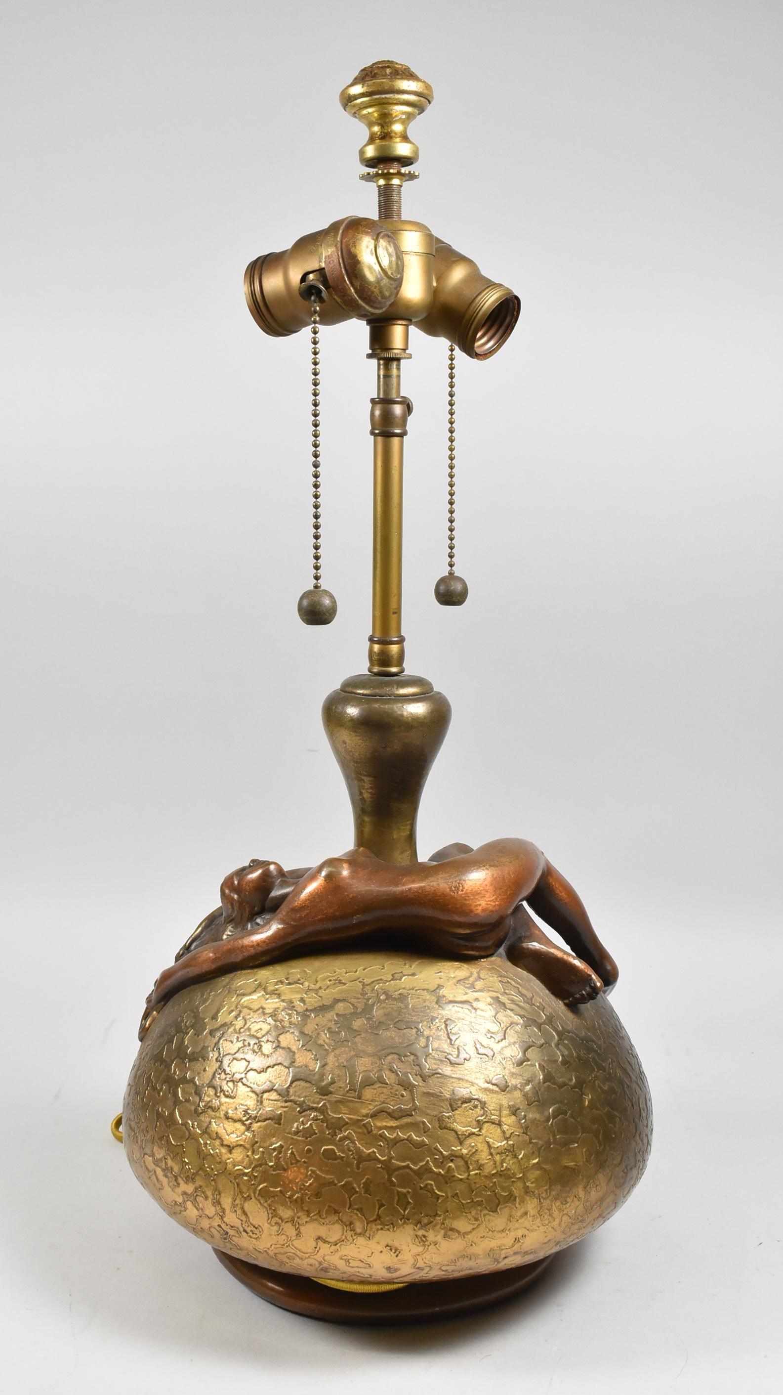 Vintage cast bronze ovoid shaped table lamp base with reclining nude figural female. Highly textured center on base, Original patina.