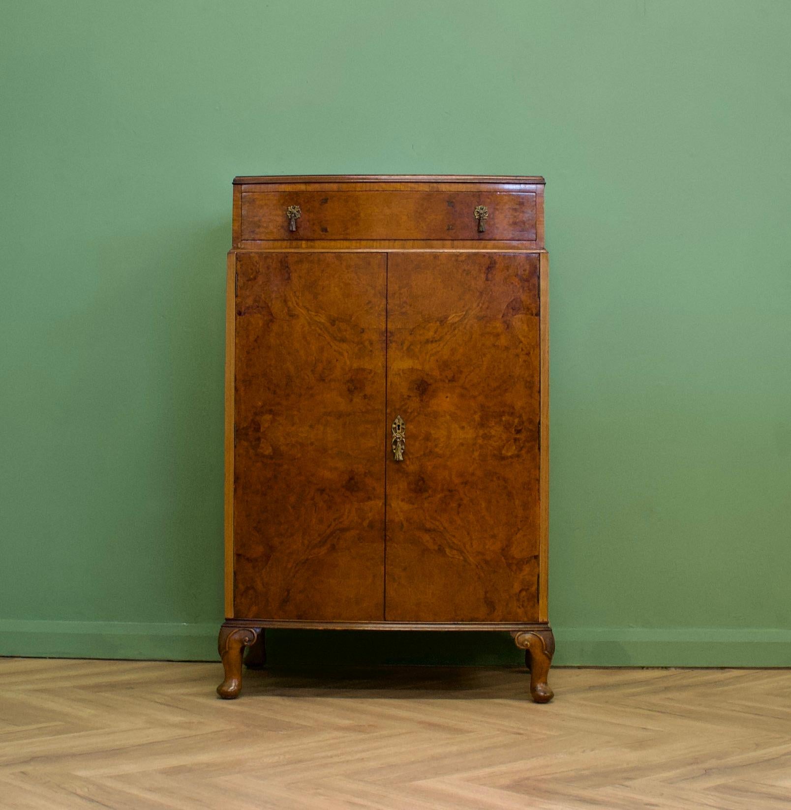An impressive quality, 1930's style burr walnut linen cabinet - perfect for a maximalist interior - circa 1930's
The walnut veneers have been beautifully quarter matched on the doors and inlaid


The interior of the top cupboard is fitted out with