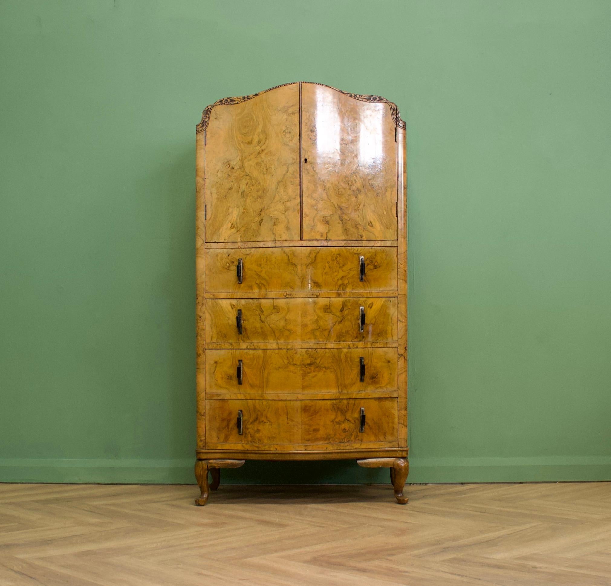 An impressive quality, 1930's style burr walnut linen cabinet - perfect for a maximalist interior - circa 1930's
The handles are metal and bakelite and there is beautiful carved detail to the top
Standing on Queen Ann legs

There is a cupboard to