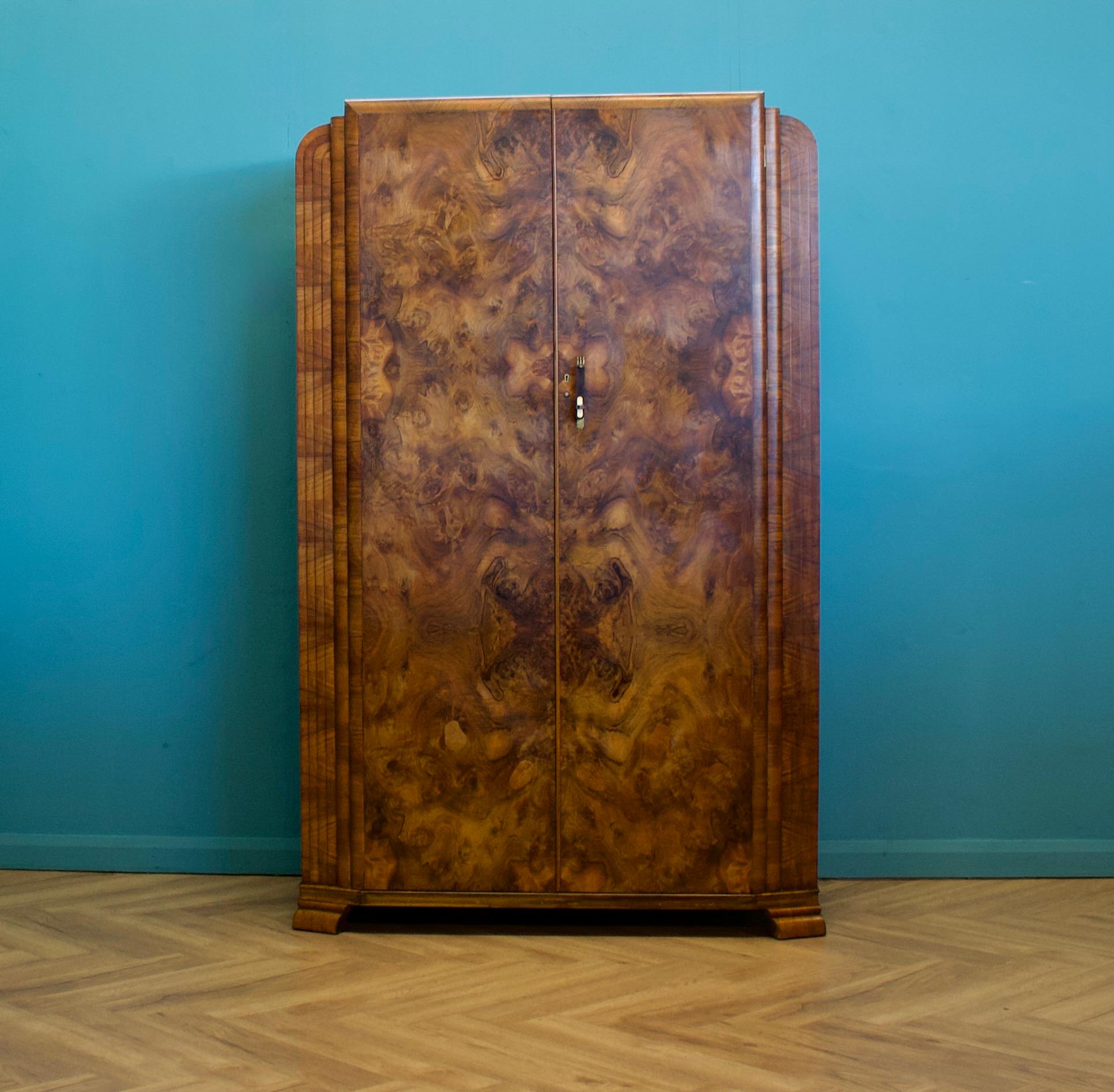 An Art Deco 1930's burr walnut wardrobe
Featuring two rails and a shelf
