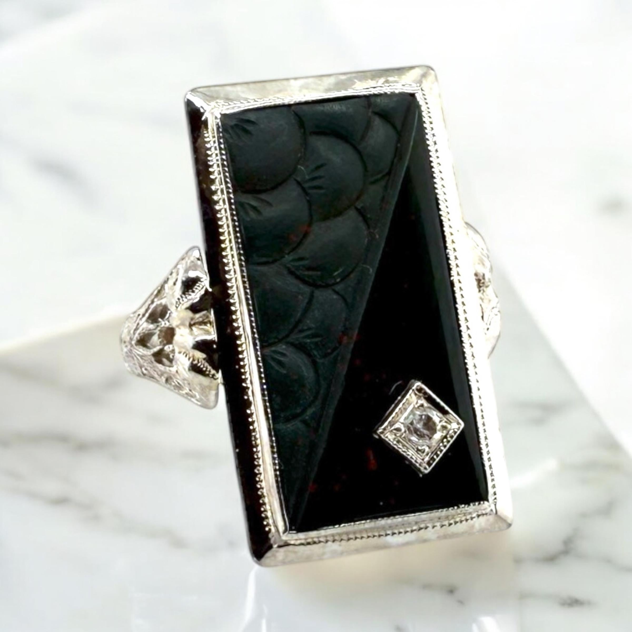 We are loving this highly unique vintage beauty!!

Ring Details
Material: 14K White Gold
Era: Art Deco 1920 - 1940
Head Length: 23mm
Head Width: 13mm
Head Height: 4.5mm
Shank Width: 2mm
Weight: 4.6 Grams
Finger Size: 5 3/4
Sizable Upon
