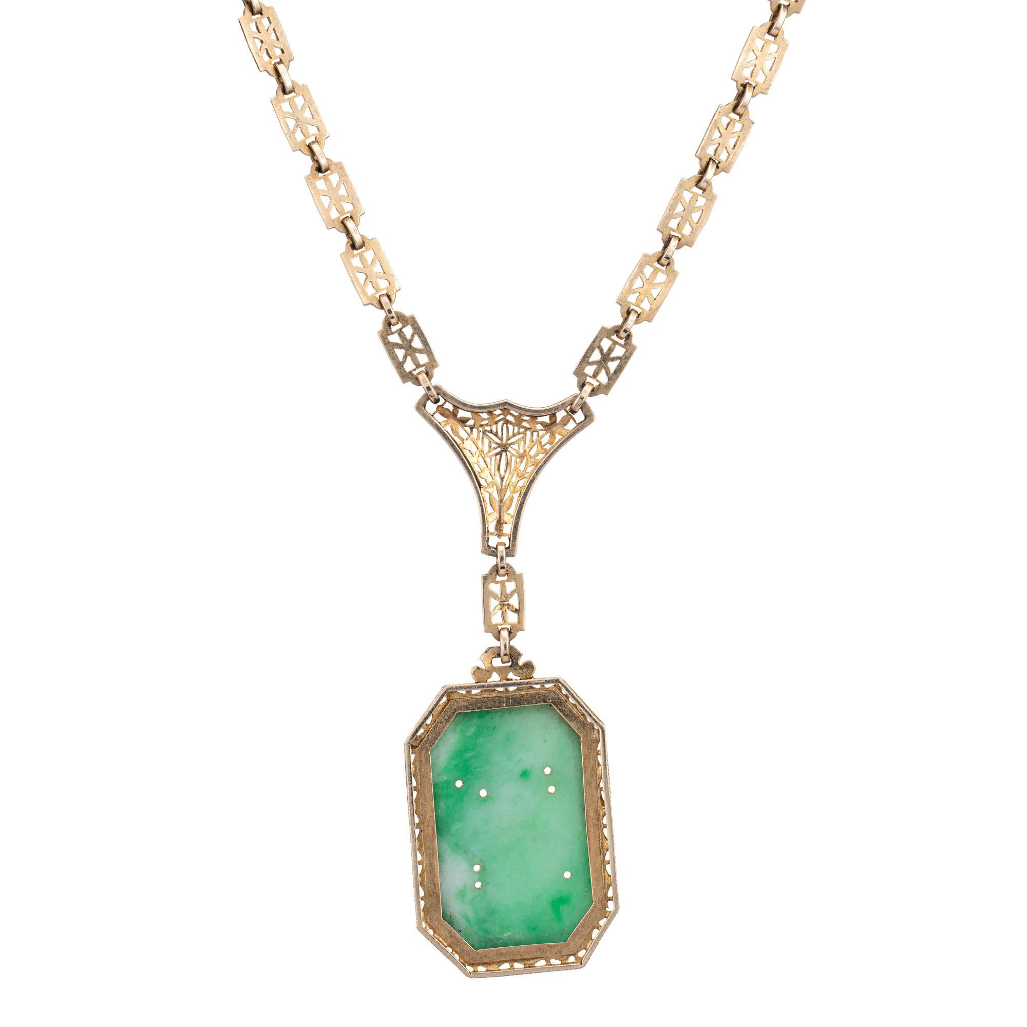 Finely detailed vintage Art Deco drop necklace (circa 1920s to 1930s), crafted in 14 karat yellow gold. 

The drop is set with carved jade measuring an25mm x 17mm. The jade is in very good condition and free of cracks or chips. 

The die-struck