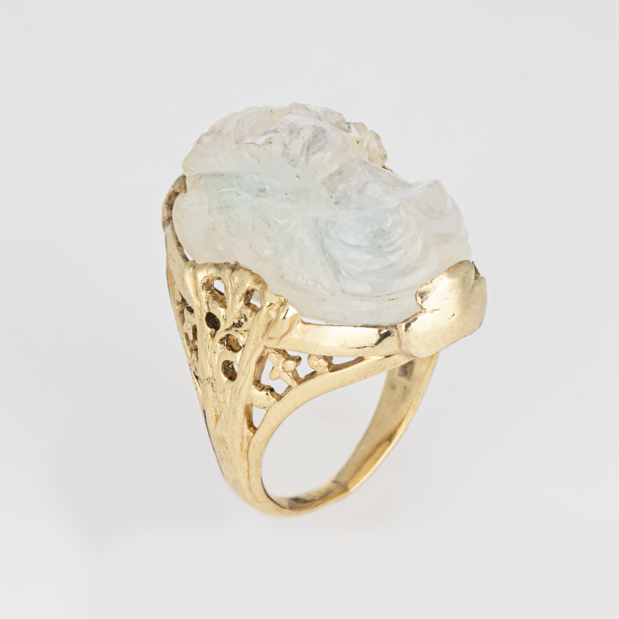Finely detailed vintage Art Deco carved moonstone ring (circa 1920s to 1930s) crafted in 14k yellow gold. 

Moonstone measures 21mm x 13mm.   

Luminous carved moonstone depicts the side profile of a woman in high relief. The moonstone glows with