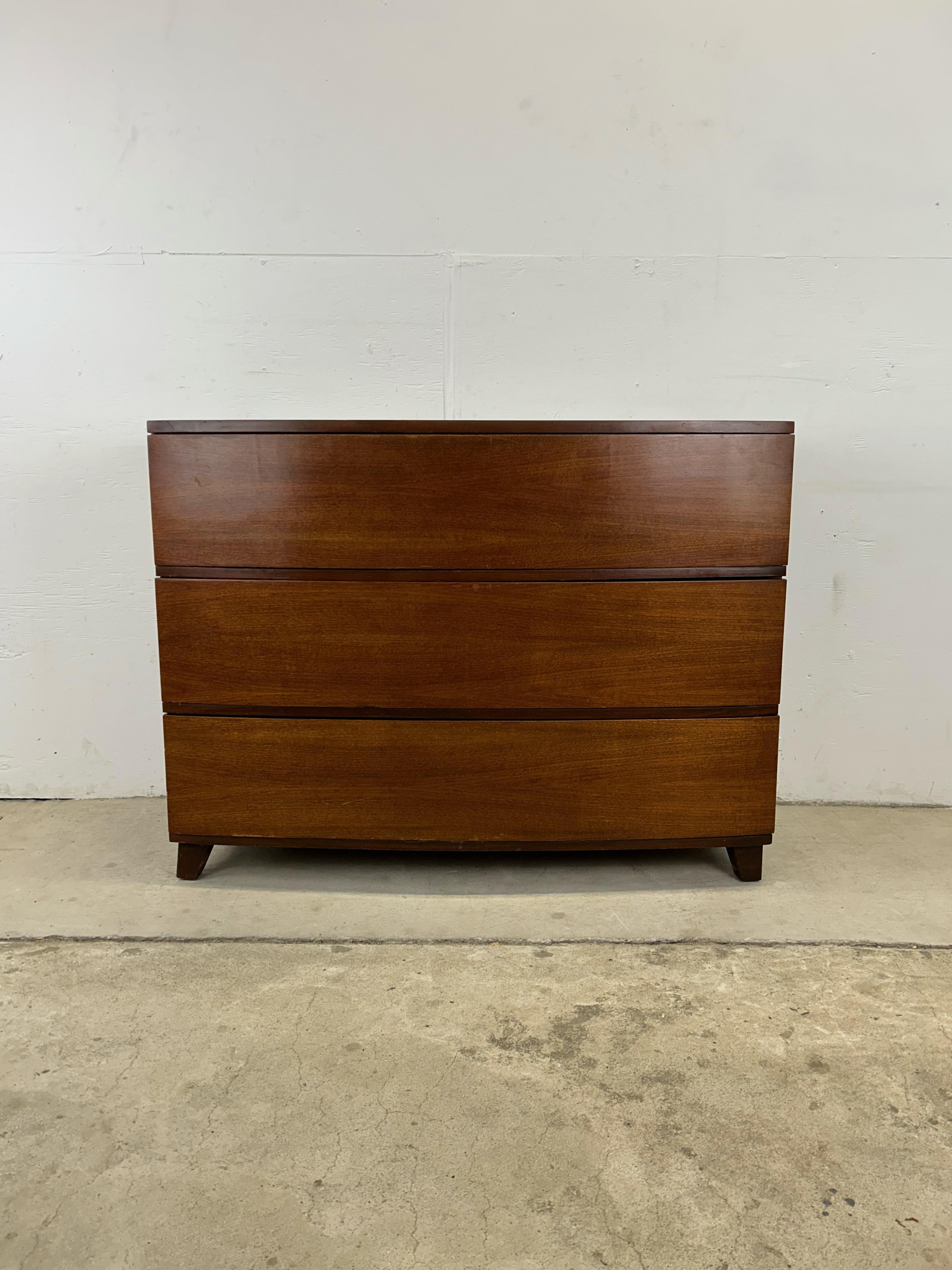 This vintage chest of drawers by TriBond Furniture features hardwood construction, original walnut veneer, three dovetailed drawers, and small tapered legs. 

Matching nightstands and cedar lined wardrobe available separately. 

Dimensions: 44w
