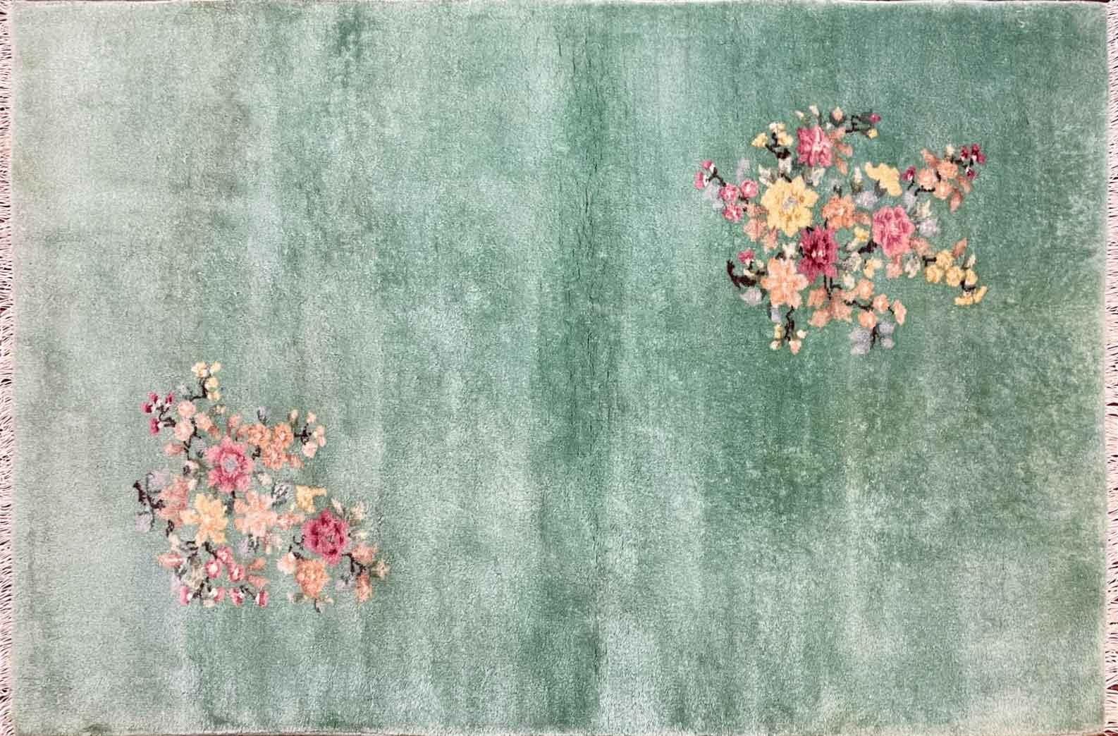 Handmade Vintage Art Deco floral Chinese Rug, 4' x 6' , c-1950's, in green color background with floral traditional design on each corner of the rug. The rug is in excellnt condition and has been professionally cleaned. This wonderful Art Deco