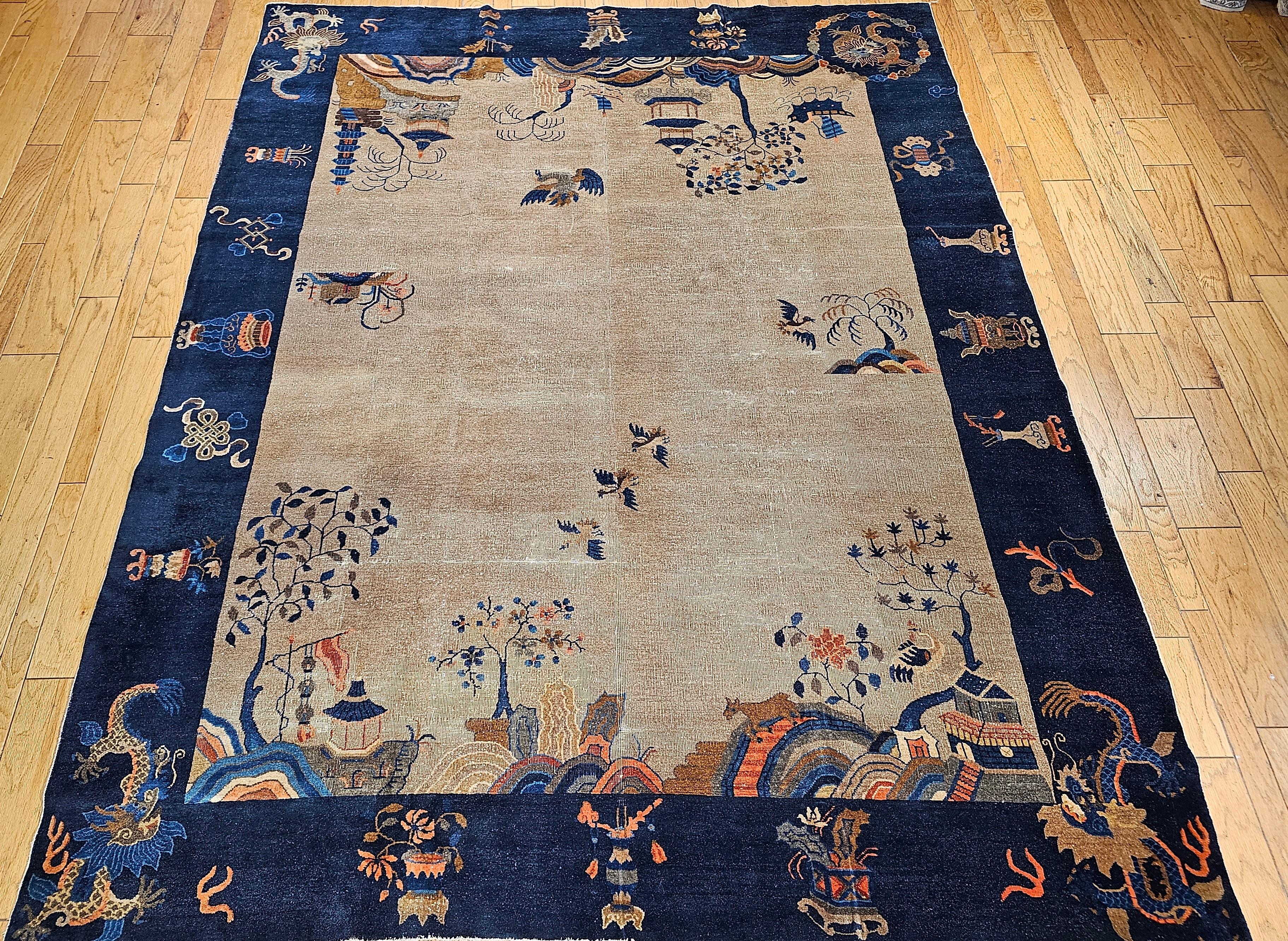  Vintage hand-knotted Chinese Art Deco rug with four dragon designs in the four corners on a light ivory/straw color field with a dark blue border. The rug also has the design of the countryside and mountains including pagodas, birds, rivers and