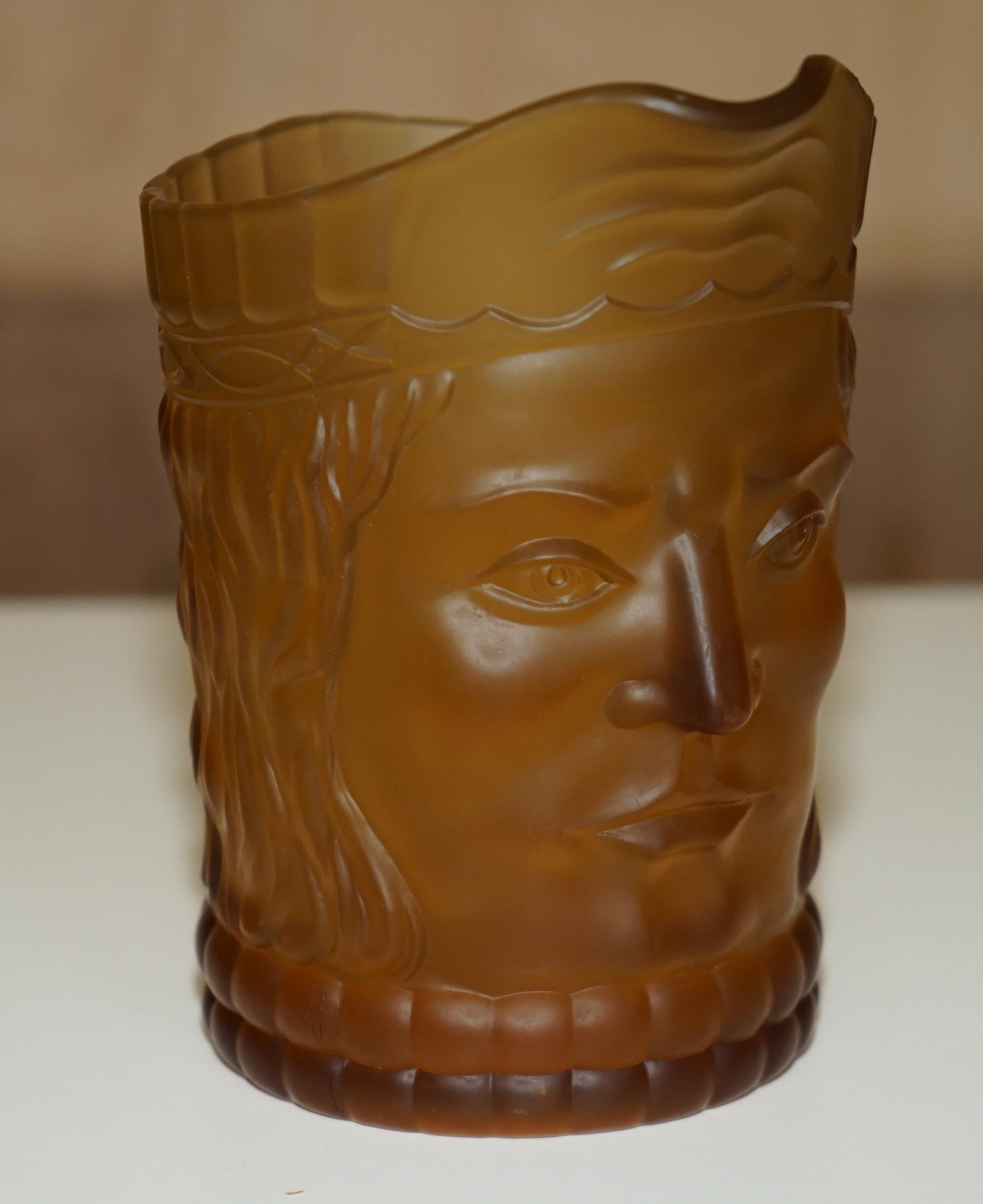 Royal House Antiques

Royal House Antiques is delighted to offer for sale this lovely circa 1920's Amber glass suite of five cups and one larger pitcher jug each depicting a primitive looking face

This is a very well made and decorative suite, I