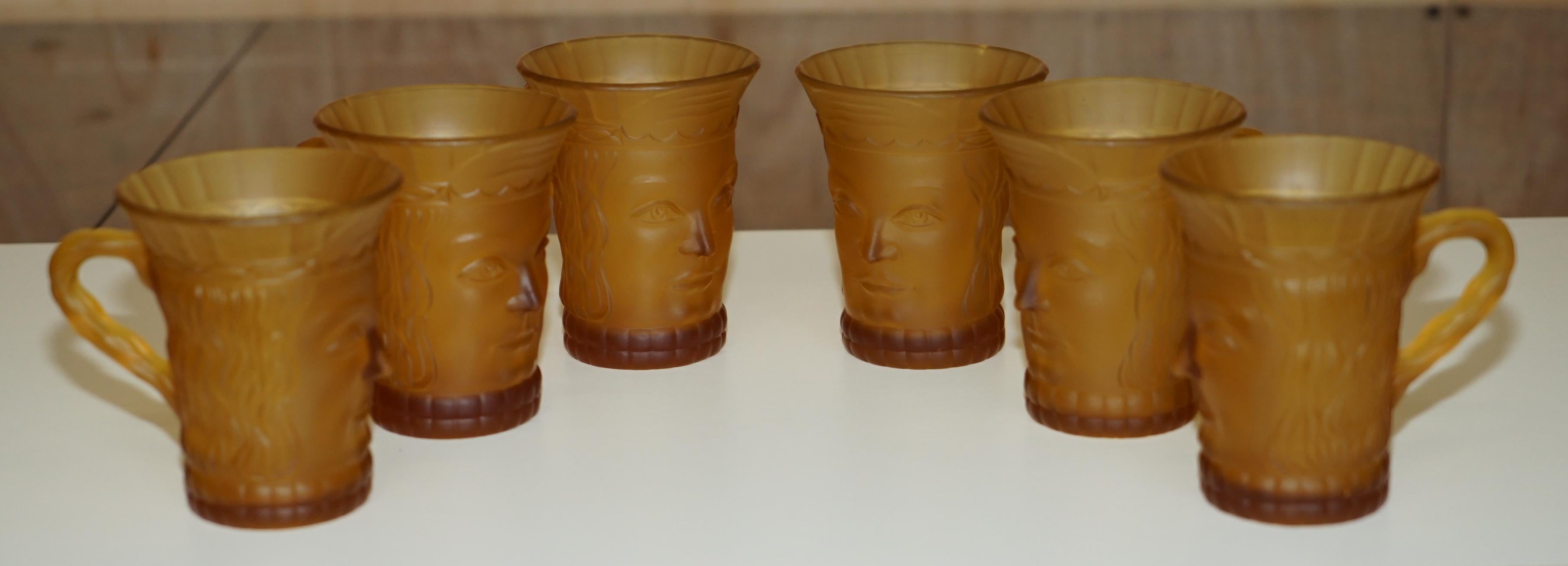 Royal House Antiques

Royal House Antiques is delighted to offer for sale this lovely circa 1920's Amber glass suite of six cups and one larger pitcher jug each depicting a primitive looking face

This is a very well made and decorative suite, I