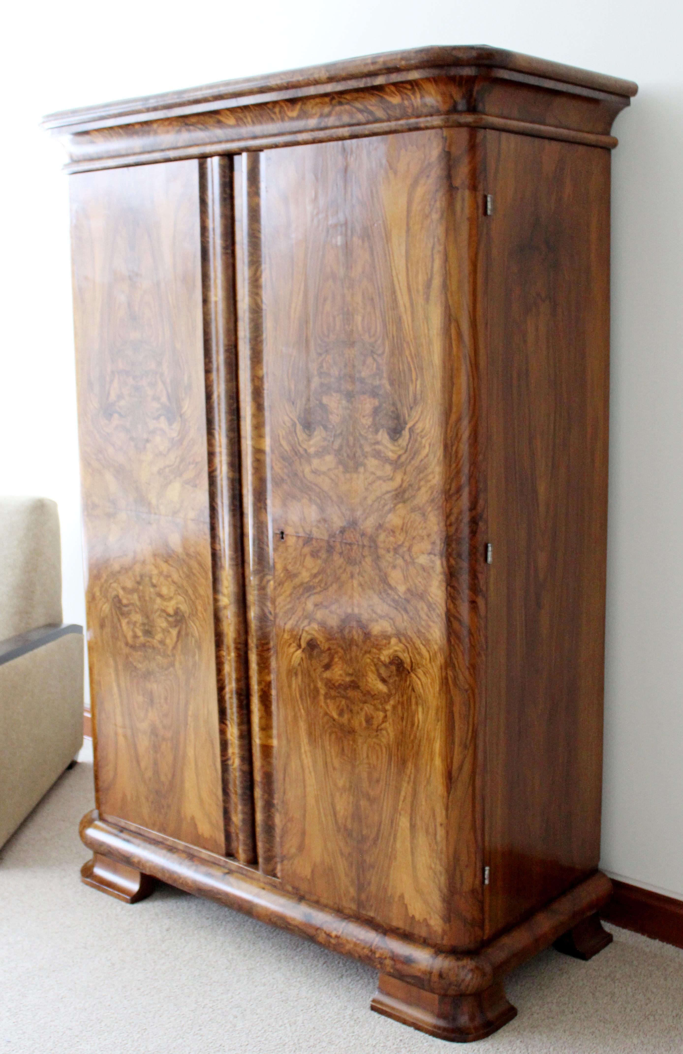 For your consideration is a stunning, antique, burl wood book matched panel cabinet armoire wardrobe unit, circa the 1940s. In very good vintage condition. The dimensions are 50.5