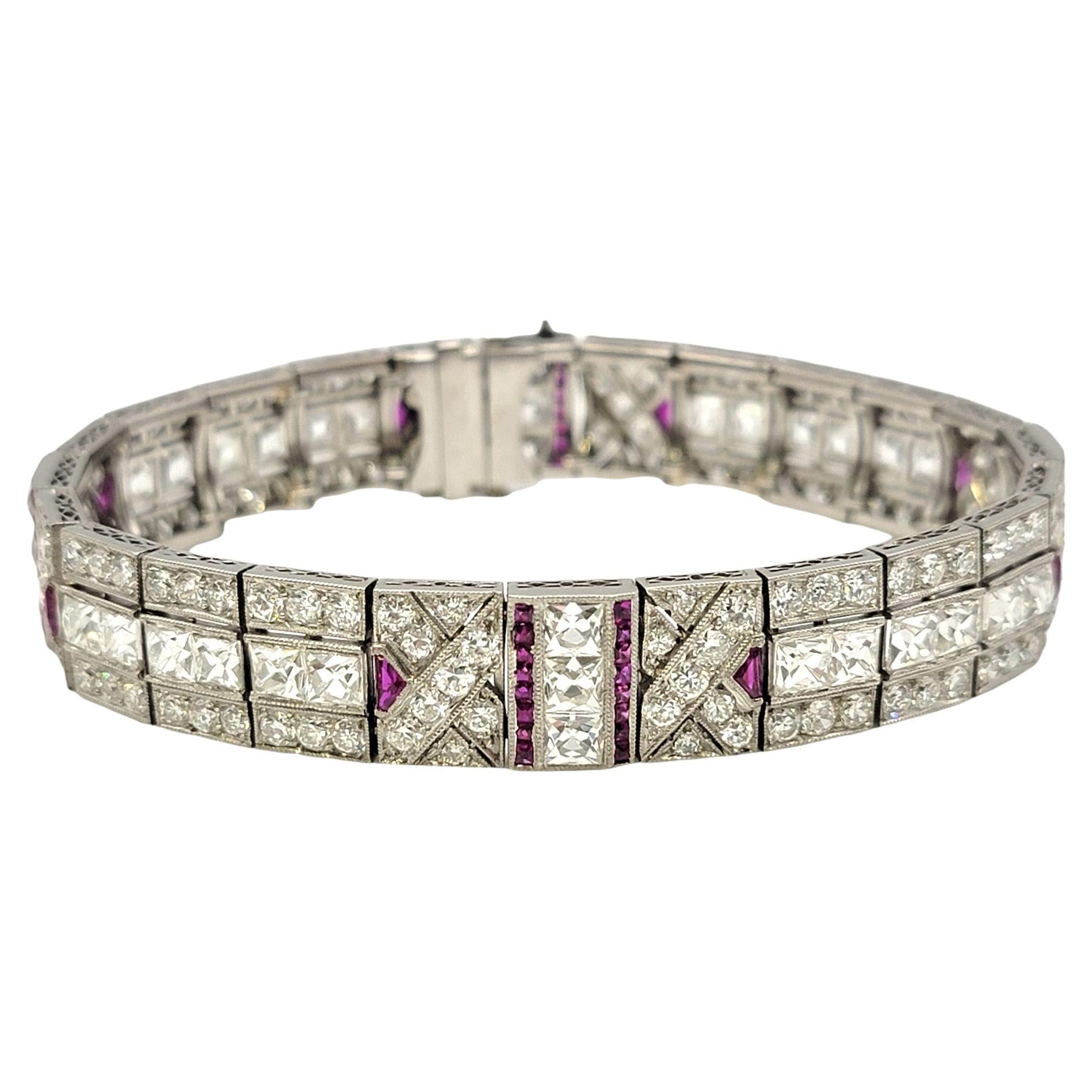 This magnificent Art Deco style French and round cut diamond and ruby bracelet brings vintage beauty to your modern life. This simply stunning bracelet features 24 rectangular shaped links embellished with 176 glittering diamonds and 72 bright red