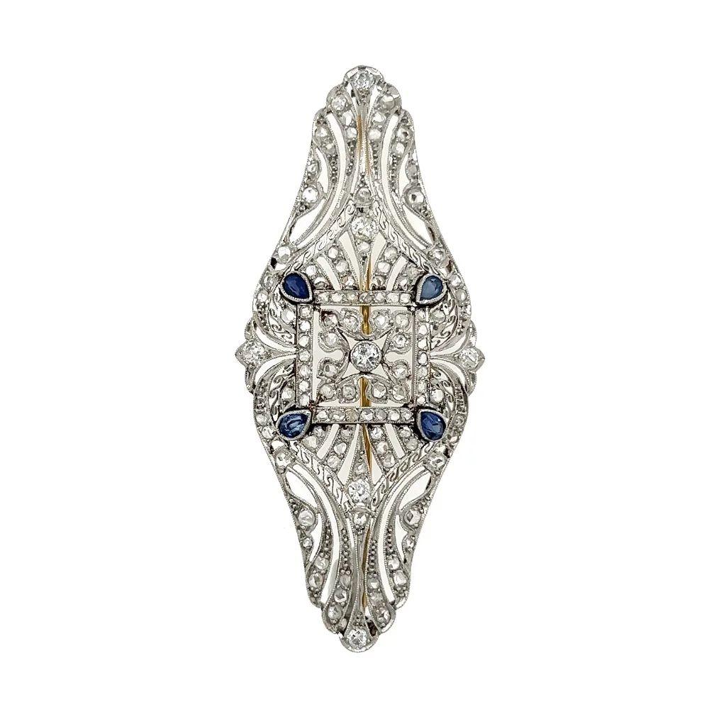 Simply Beautiful! Finely detailed Vintage Art Deco Filigree Diamond and Sapphire Platinum Brooch. Beautifully Hand crafted in Platinum and Hand set with Diamonds weighing approx. 1.75tcw and accented by Blue Sapphires, approx. 0.30tcw. Brooch