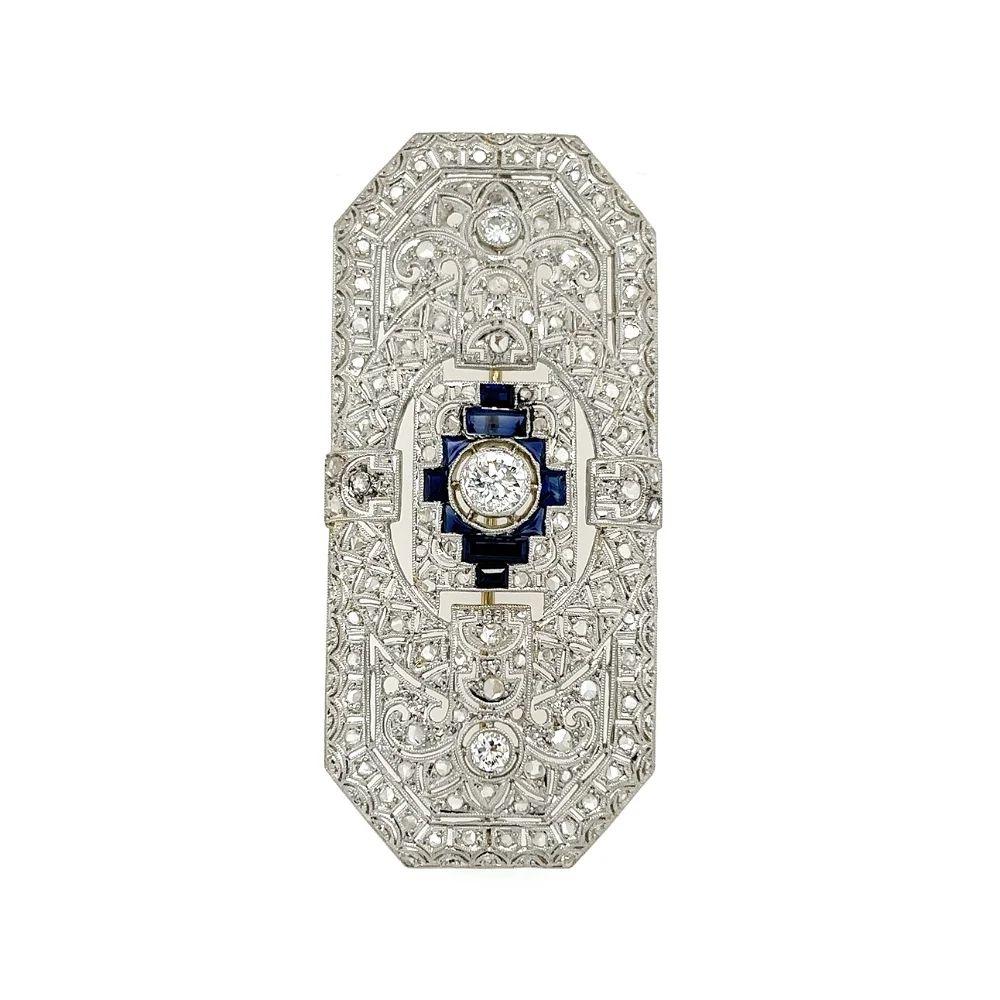 Simply Beautiful! Finely detailed Vintage Art Deco Rectangular Diamond and 0.75tcw Calibrated Sapphire Platinum Brooch. Beautifully Hand crafted in Platinum and Hand set with Center OEC Diamond weighing approx. 0.45 Carat. Diamonds weighing approx.