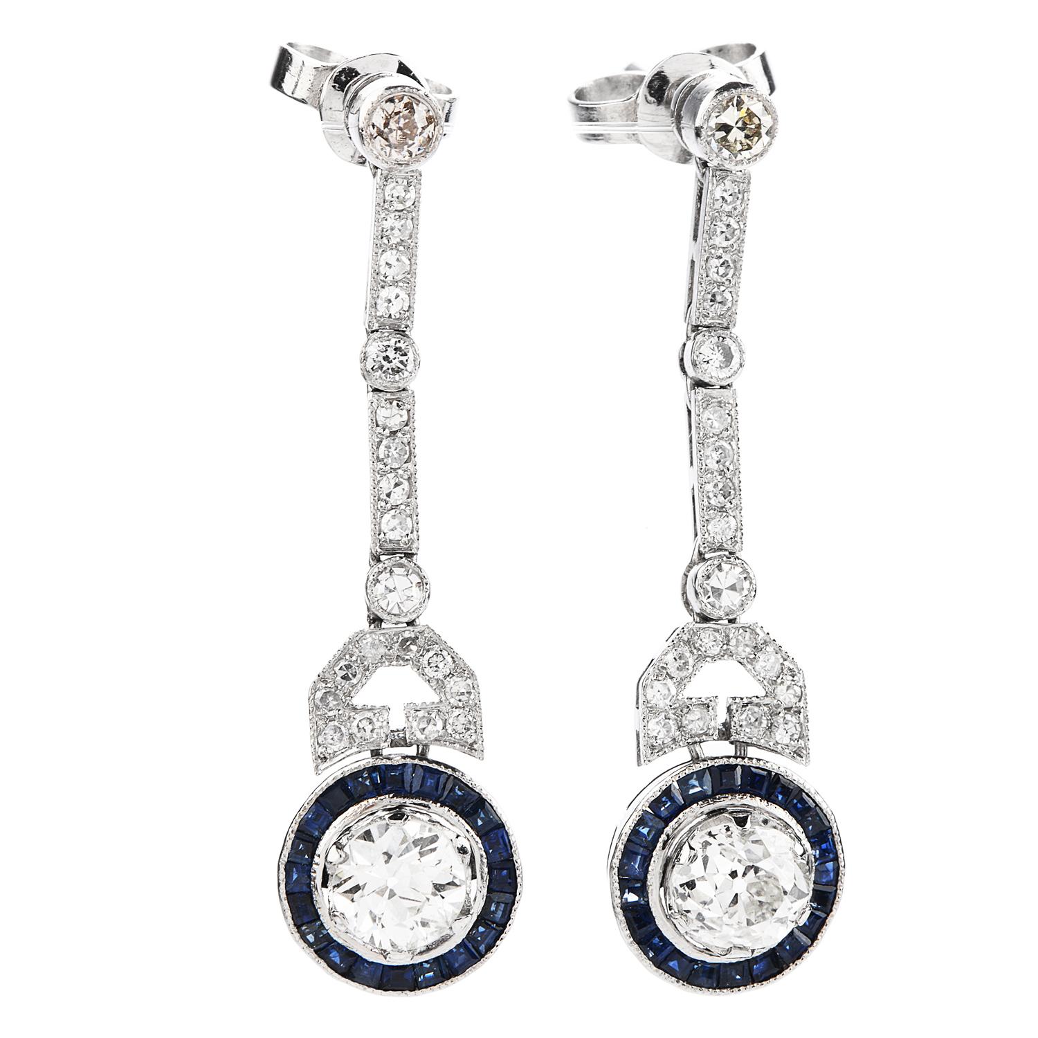 Vintage halo design dangle earrings, with an excellent finish.

Crafted in solid Platinum, there are (2) round-cut center old European-cut round Diamonds weighing approximately 1.10 carats (H-I color and VS clarity)

For color display there are (42)