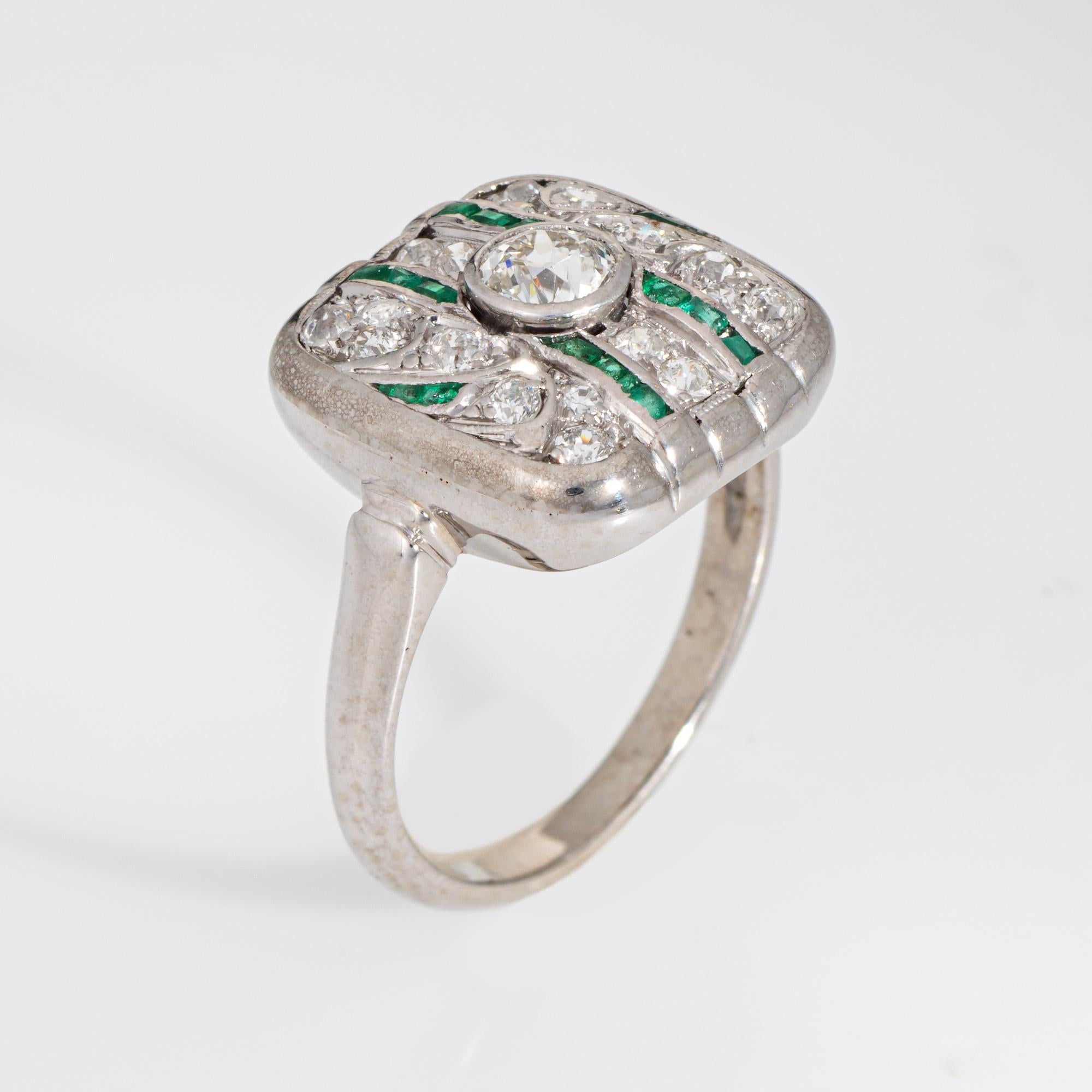 Finely detailed vintage Art Deco diamond & emerald ring (circa 1920s to 1930s) crafted in 14k white gold. 

Center set old European cut diamond is estimated at 0.35 carats, accented with a further estimated 0.25 carats of old mine and single cut
