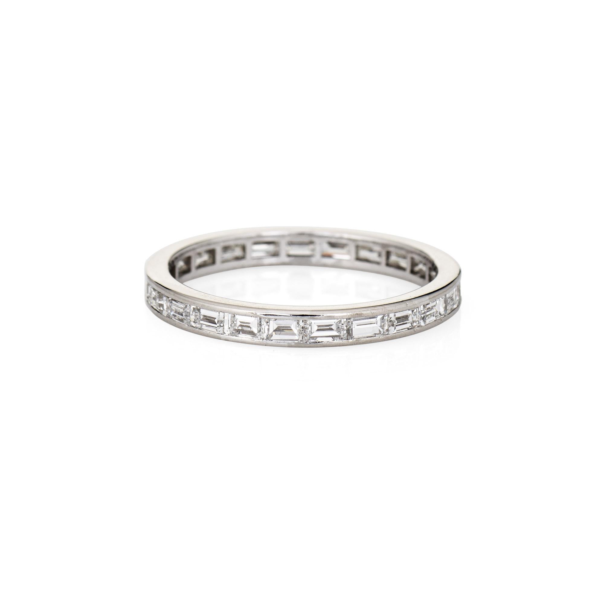 Stylish vintage Art Deco diamond eternity ring (circa 1920s to 1930s) crafted in platinum. 

23 emerald cut diamonds total an estimated 0.92 carats (estimated at G-H color and VS1-22 clarity).  

The elegant Art Deco era ring features sparkling