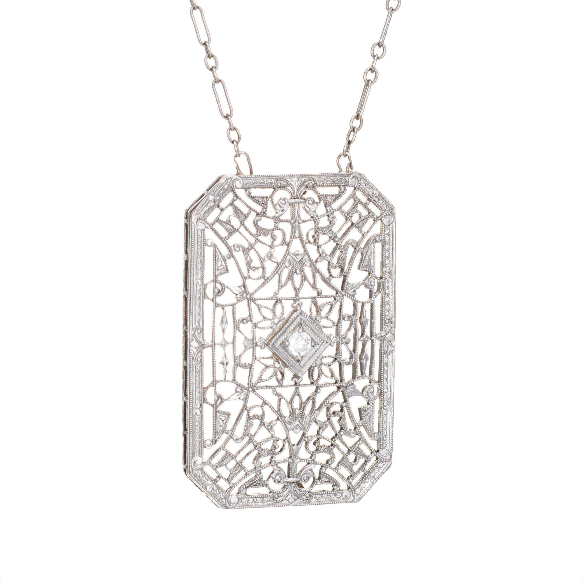 Finely detailed vintage Art Deco drop necklace (circa 1920s to 1930s), crafted in 14 karat white gold. 

The drop is set with an estimated 0.04 carat Old European cut diamond (estimated at H-I color and SI1 clarity).  

The die-struck necklace