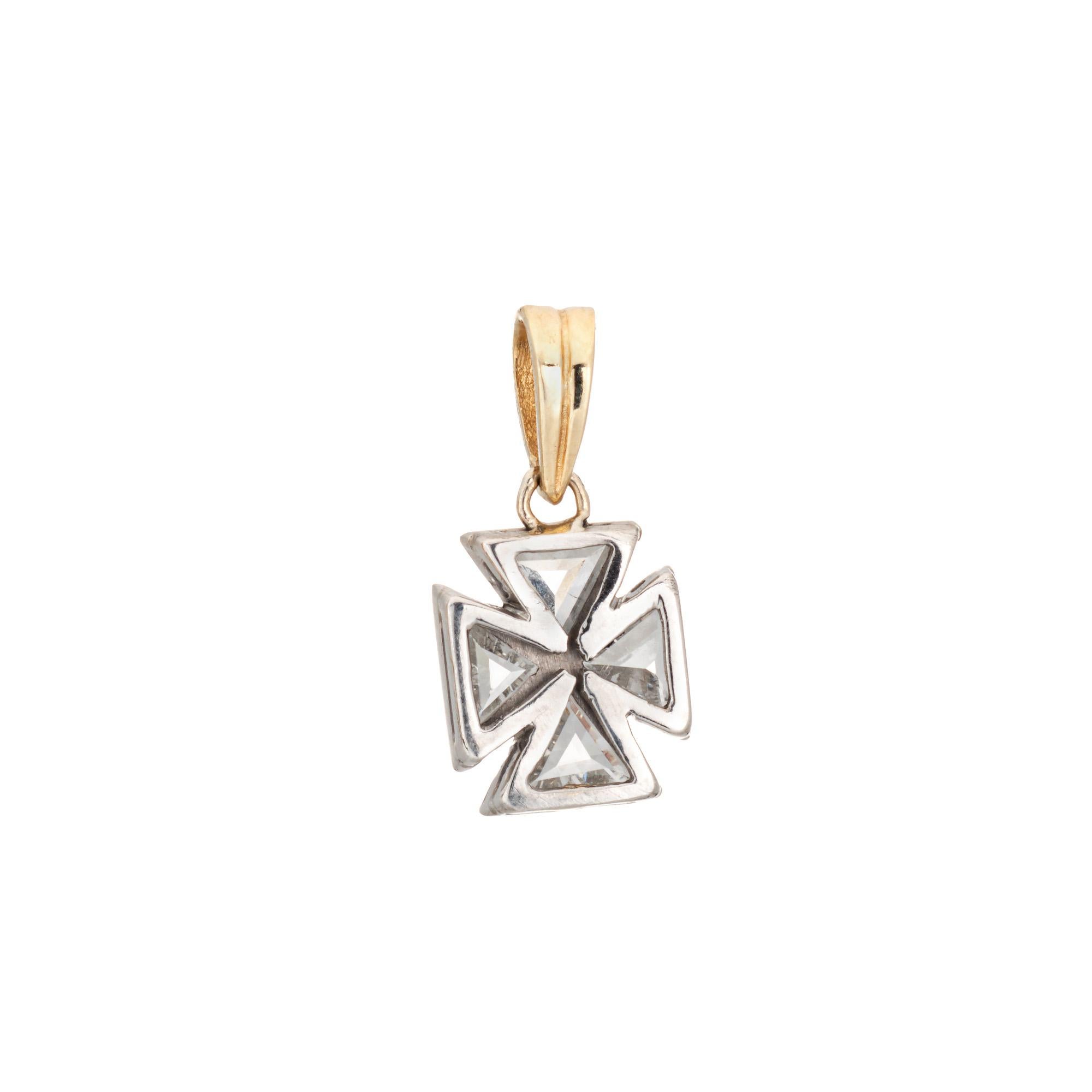Finely detailed vintage Art Deco era Maltese Cross pendant crafted in 900 platinum & 14 karat yellow gold (circa 1920s to 1930s). 

Four triangular cut diamonds total an estimated 0.80 carats (estimated at H-I color and VS2-SI1 clarity).   

A