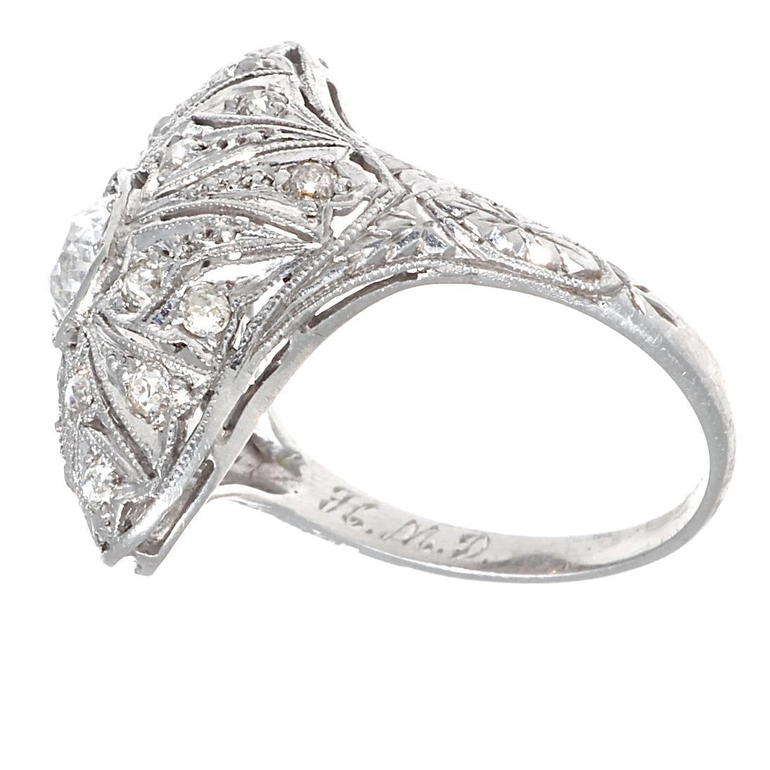 Keep creating beautiful memories with this stunning vintage Art Deco ring that offers lots of ring coverage without the hefty price tag. Featuring one old European cut diamond that weighs approximately 0.35 carats and is graded with H-I color, and
