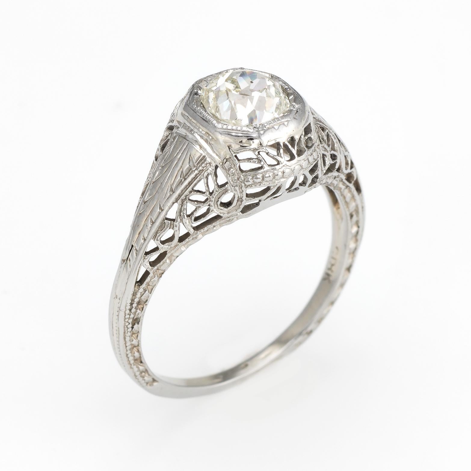 Elegant & finely detailed Art Deco era ring (circa 1920s to 1930s), crafted in 18 karat white gold. 

Centrally mounted estimated 0.60 carat Old Mine cut (estimated at K-L color and SI2 clarity).   

The ring epitomizes vintage charm and would make