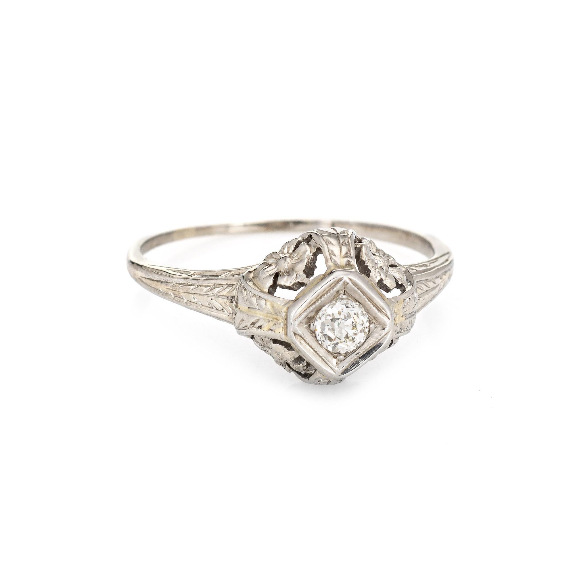 Finely detailed vintage Art Deco diamond engagement ring (circa 1920s to 1930s) crafted in 14 karat white gold. 

One old mine diamond is estimated at 0.20 carats (estimated at J-K color and VS2 clarity). 

The old mine cut diamond is set into an
