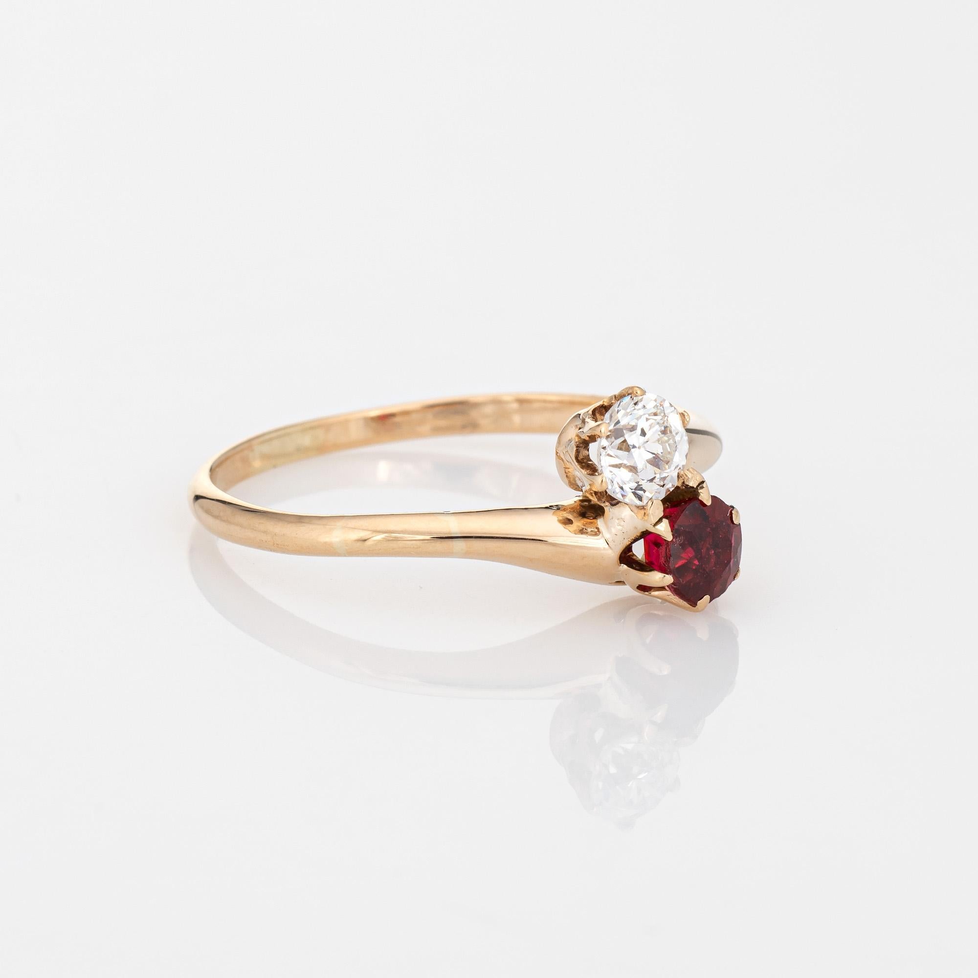 Finely detailed vintage Art Deco era diamond & synthetic ruby 'moi et toi' ring crafted in 14k yellow gold (circa 1920s to 1930s).  

Old European cut diamond is estimated at 0.25 carats (estimated at I-J color and VS2-SI1 clarity). The lab created