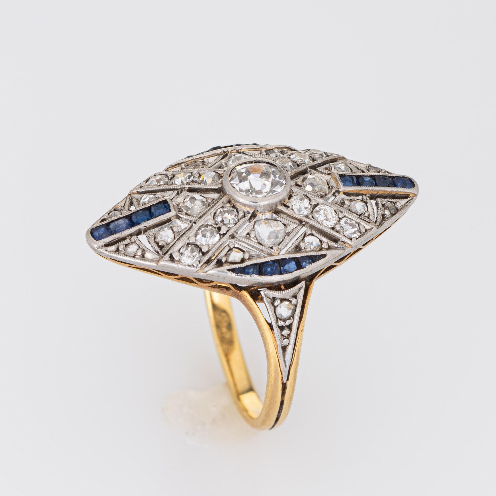 Finely detailed vintage Art Deco diamond cocktail ring (circa 1920s to 1930s) crafted in 18k yellow gold and platinum.

Old European and rose cut diamonds total an estimated 0.60 carats (estimated at I-J color and SI2-I1 clarity). 20 sapphires total