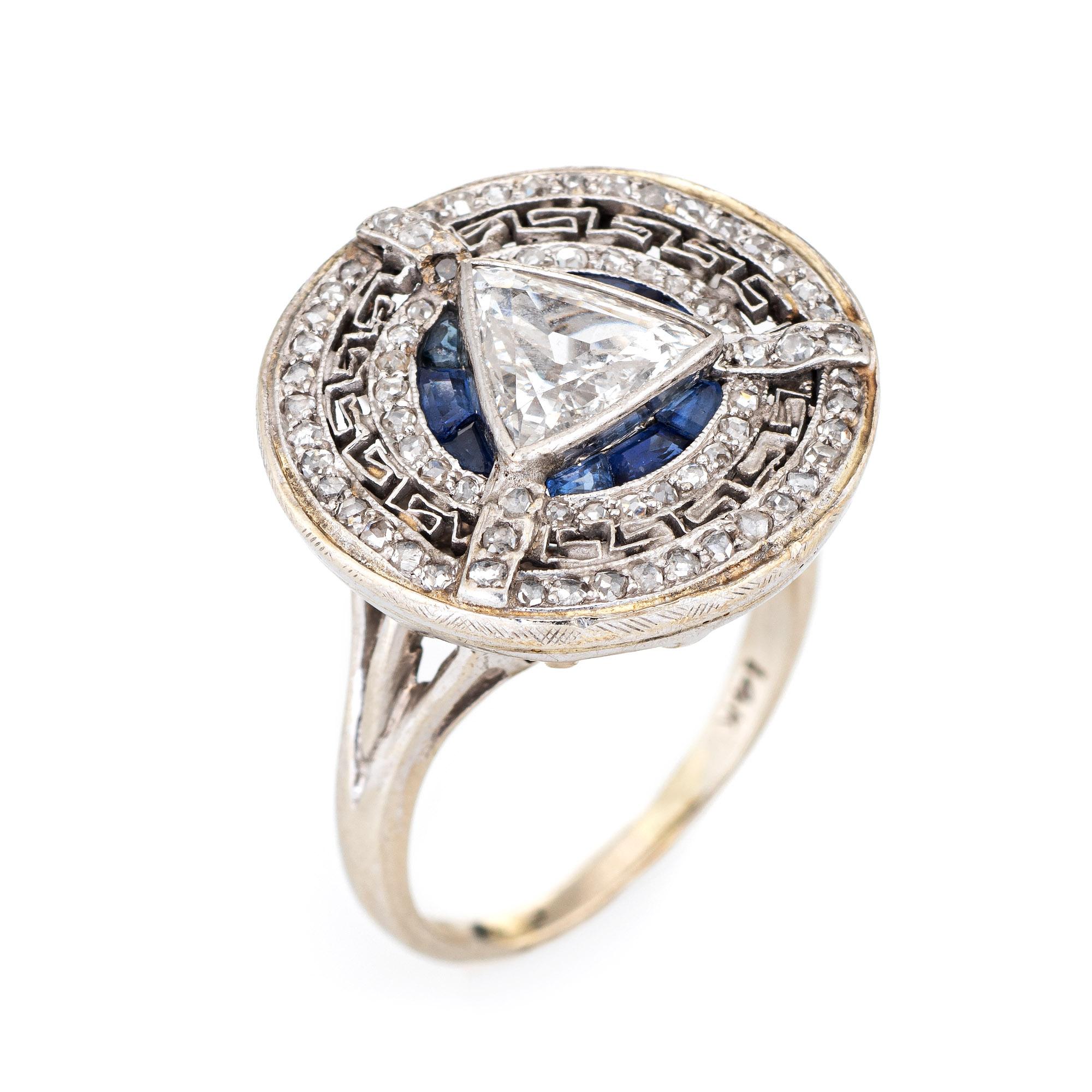 Stylish & finely detailed vintage Art Deco diamond & sapphire ring (circa 1920s to 1930s) crafted in 14k white gold. 

Center set triangle shaped brilliant cut diamond measures 8mm x 2.1mm (estimated at 0.75 carats - F color/SI1 clarity).