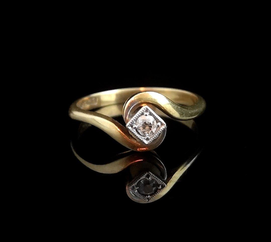 A beautiful vintage Art Deco diamond, crossover solitaire ring.

A decadent beauty, it would make for a beautiful Art engagement ring or perhaps just a treat for yourself or somebody special.

Smooth and substantial 18 karat yellow gold band with a