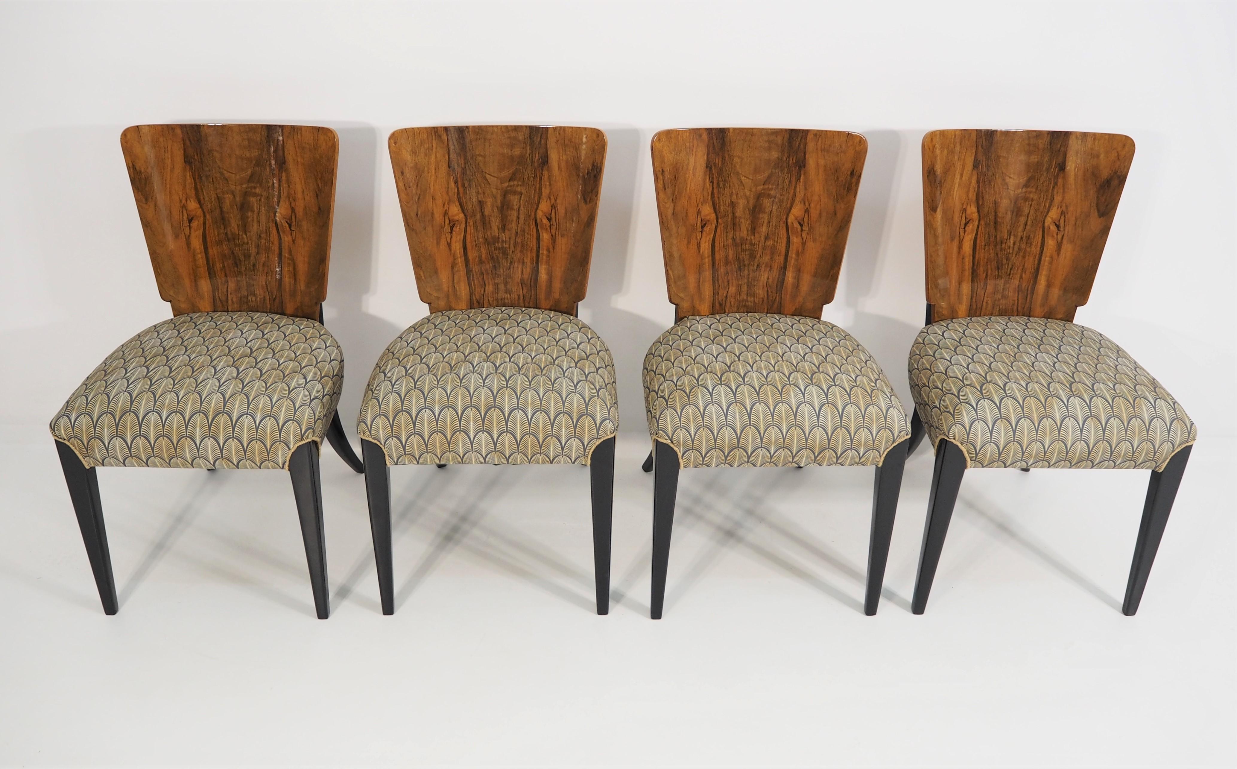 These 4 chairs were designed by Jindrich Halabala in former Czechoslovakia in the 1940s. Beautiful walnut veneer.