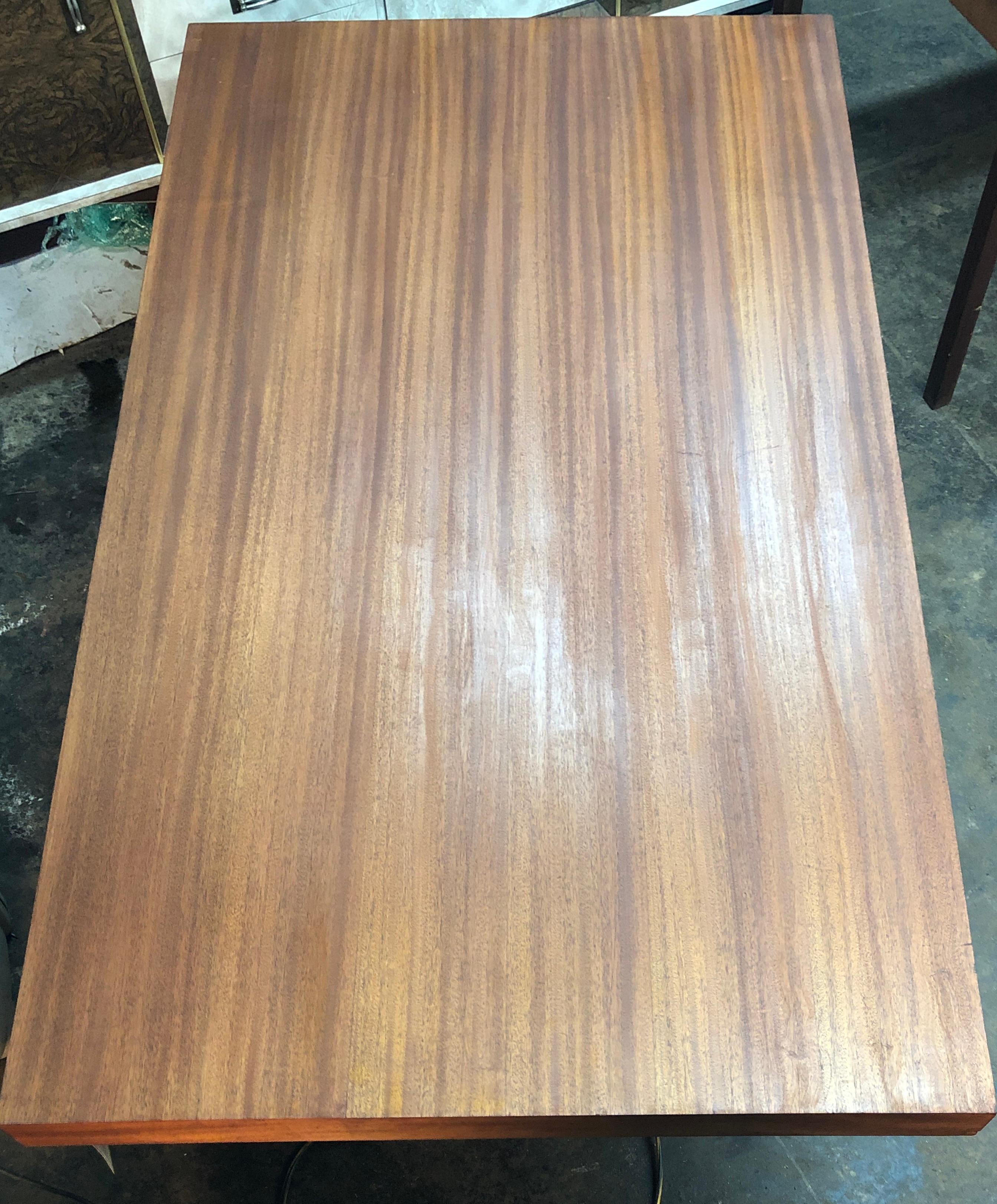 A stunning art deco style mahogany table, sure to impress your guests for years to come. A large tabletop provides plenty of room for anything from dinner parties to board meetings. An attractive contrasting bentwood base provides ample sturdiness.