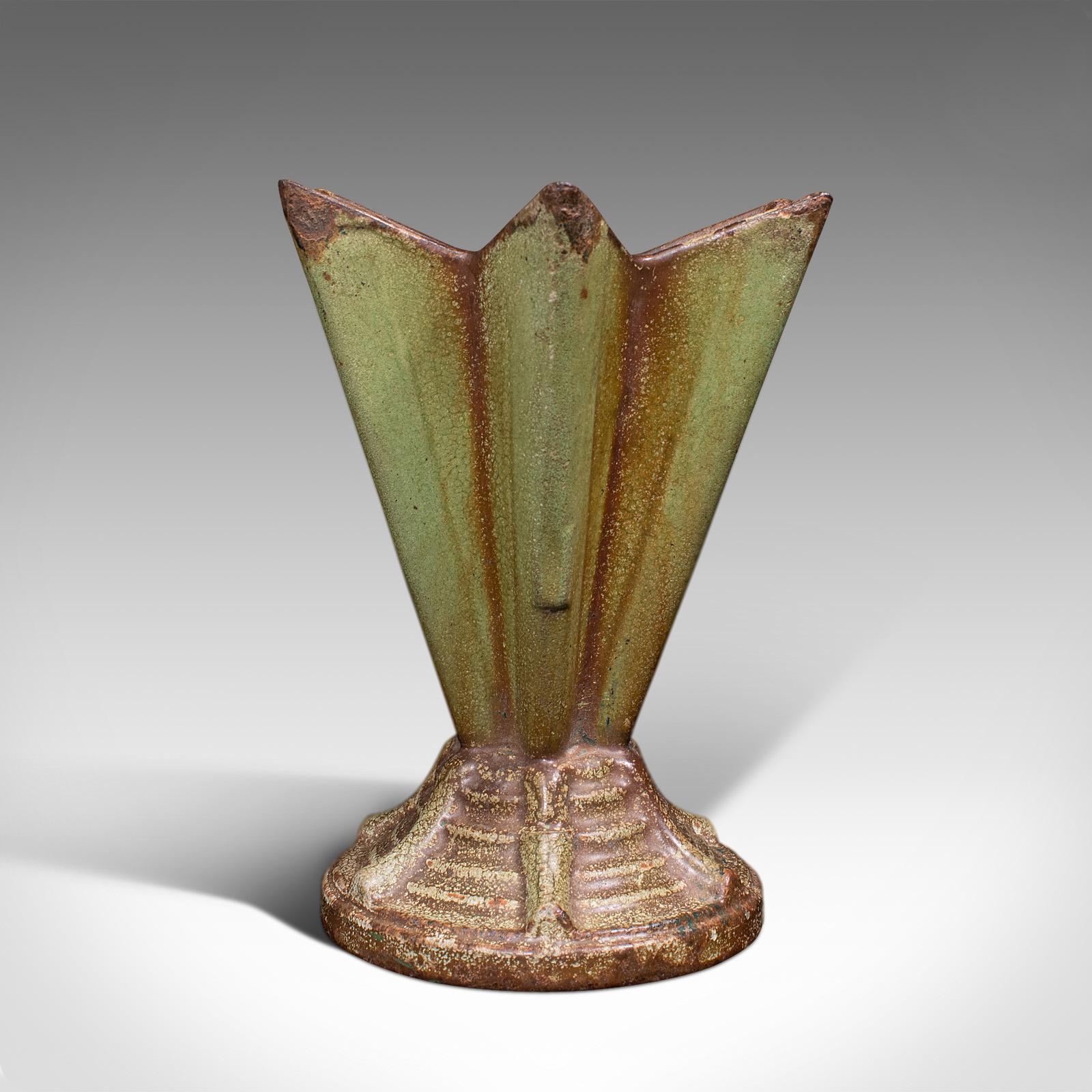 This is a vintage Art Deco display vase. An English, cast iron planter or petite jardiniere, dating to the early 20th century, circa 1930.

Distinguished vase with six-pointed star form
Displays a desirable aged patina throughout
Graced with its
