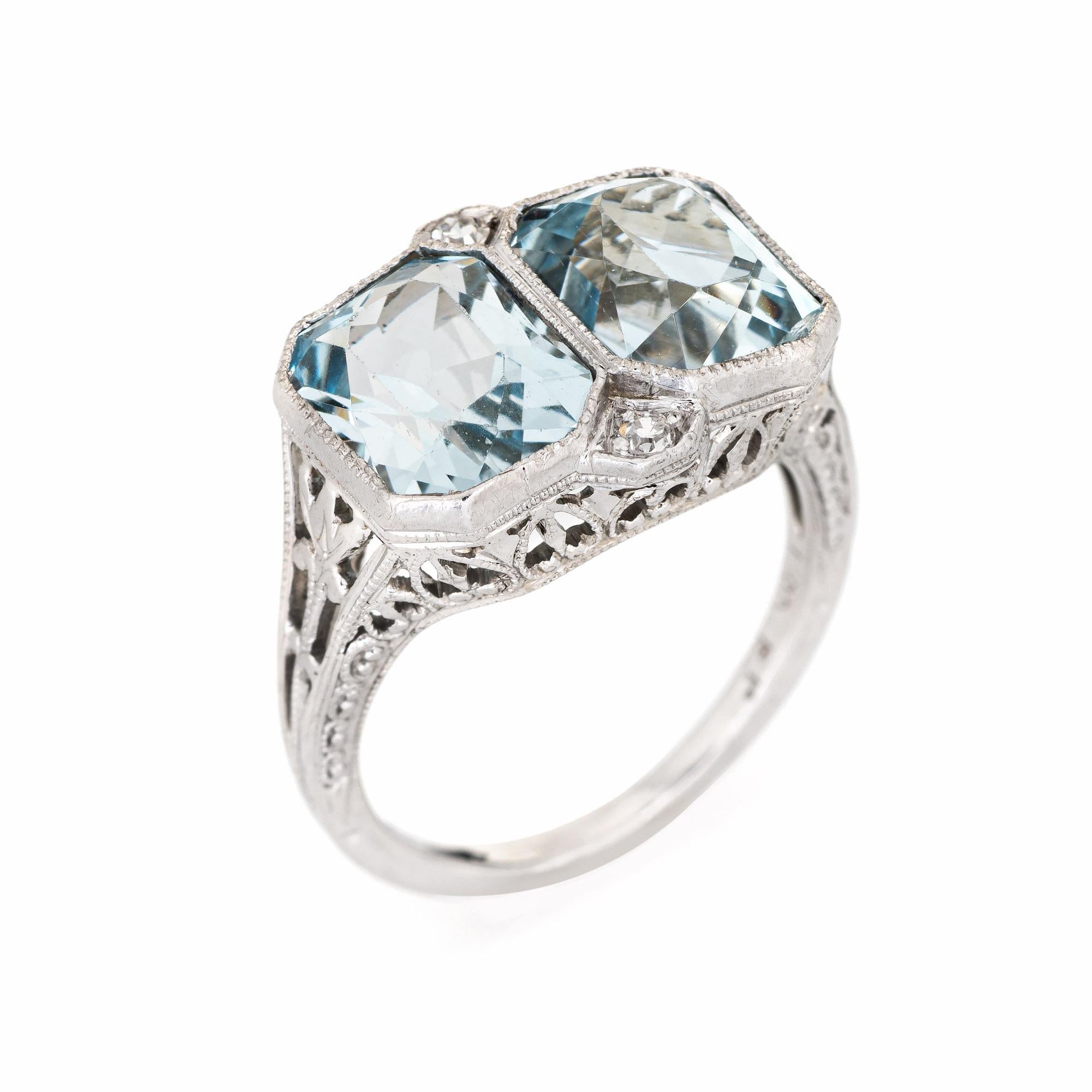 Finely detailed vintage Art Deco double aquamarine & diamond ring (circa 1920s to 1930s) crafted in 18k white gold. 

Two aquamarines measure 8.5mm x 7mm each (estimated at 2.50 carats each - 5 carats total estimated weight), accented with 0.04