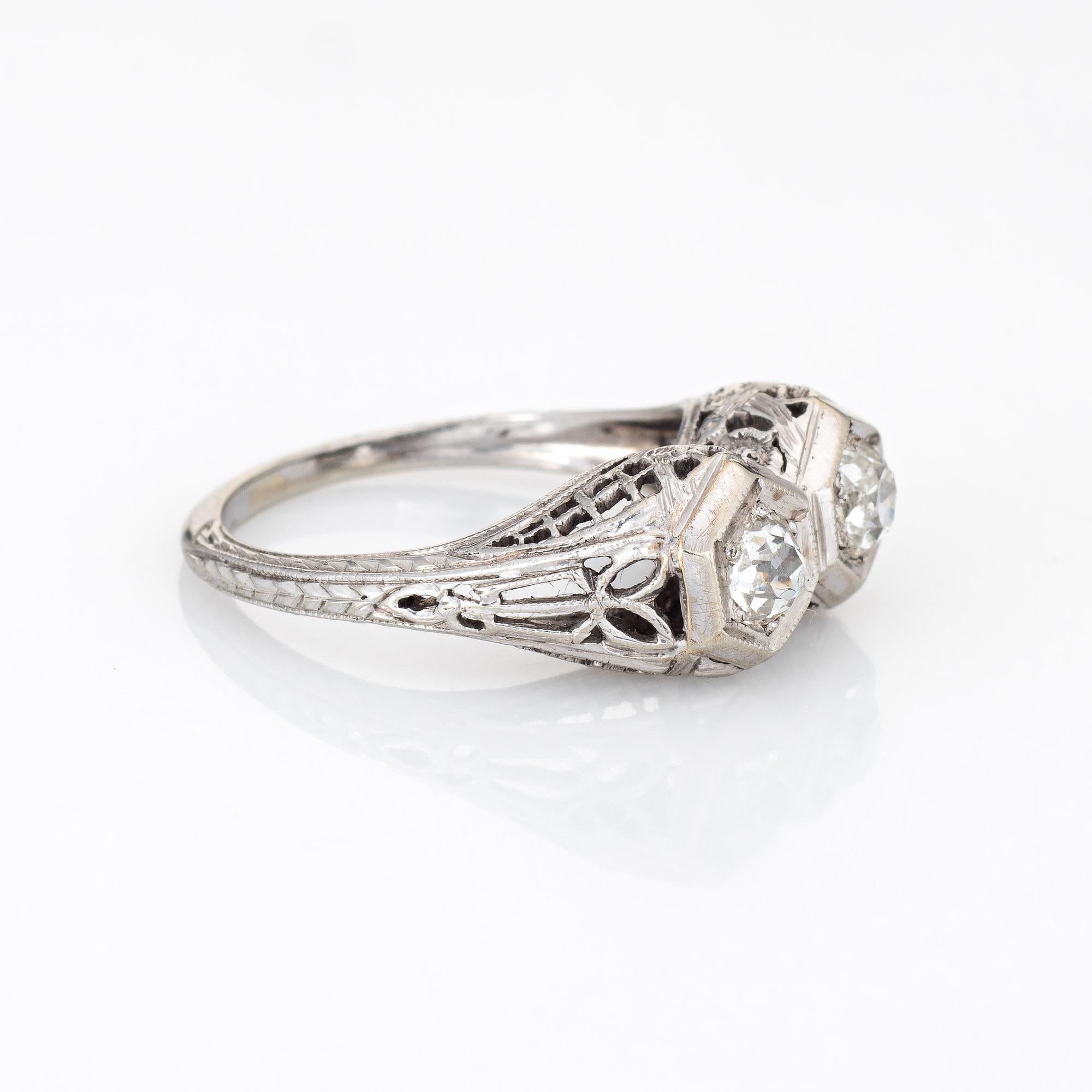 Elegant & finely detailed vintage Art Deco era ring (circa 1920s to 1930s) crafted in 18k white gold. 

Two centrally mounted estimated 0.35 carat old mine cut diamonds total an estimated 0.70 carats(estimated at I-J color and SI1-2 clarity).    
