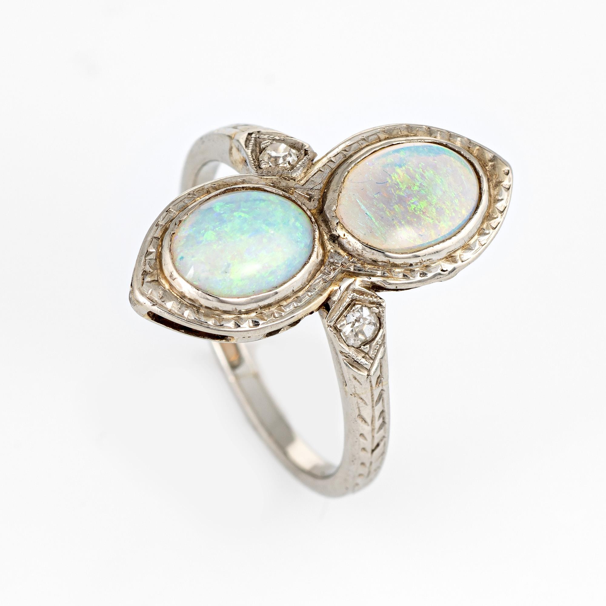 Stylish vintage Art Deco era double opal & diamond cocktail ring (circa 1920s to 1930s) crafted in 18 karat white gold. 

Natural opals each measure 7mm x 5mm (estimated at 0.80 carats each - 1.60 carats total estimated weight). Two estimated 0.03