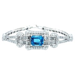 Bracelet Art déco vintage en platine avec topaze bleue taille émeraude et diamants 