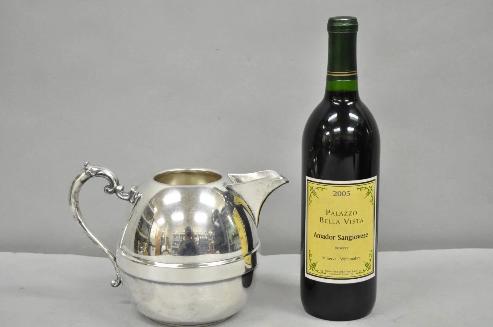 Vintage Art Deco Silver Plated Bulbous Water Pitcher with Handle. Circa Mid 20th Century. Measurements: 6