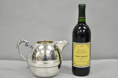 P & A d'epoca in stile Art Deco. Brocca per acqua bulbosa in rame placcato argento con manico