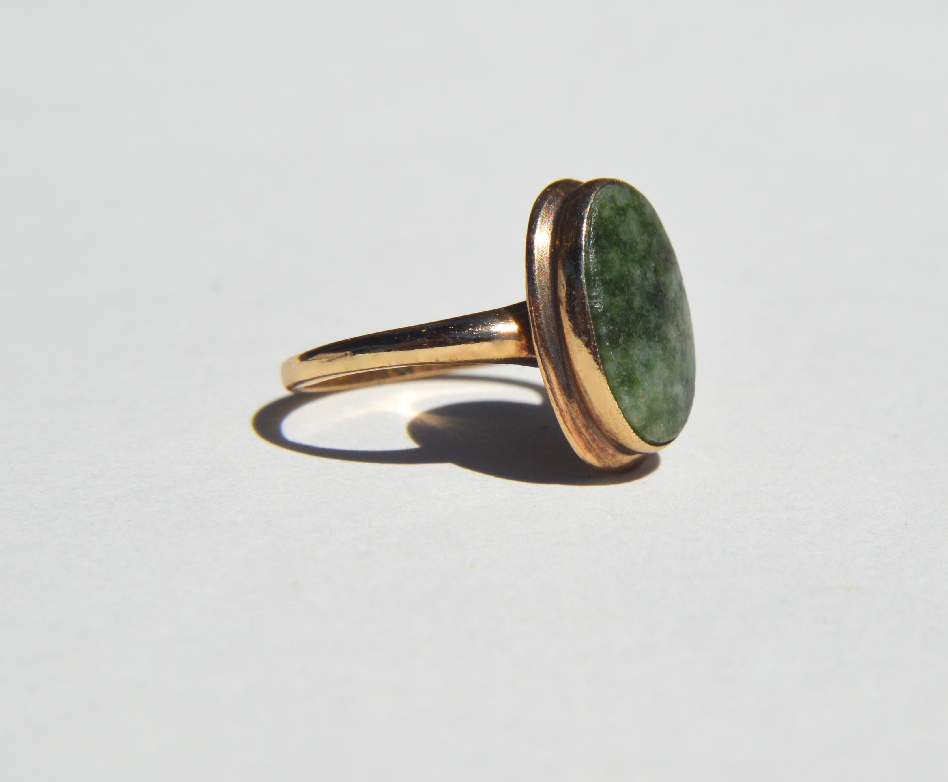 Beautiful Art Deco era 1920s nephrite jade 10K yellow gold signet ring. Size 6.25, can be resized for an additional $40. Marked as 10K PSCO (Plainville Stock Company, established in 1884). Ring is in fair condition, the jade stone is a bit worn and
