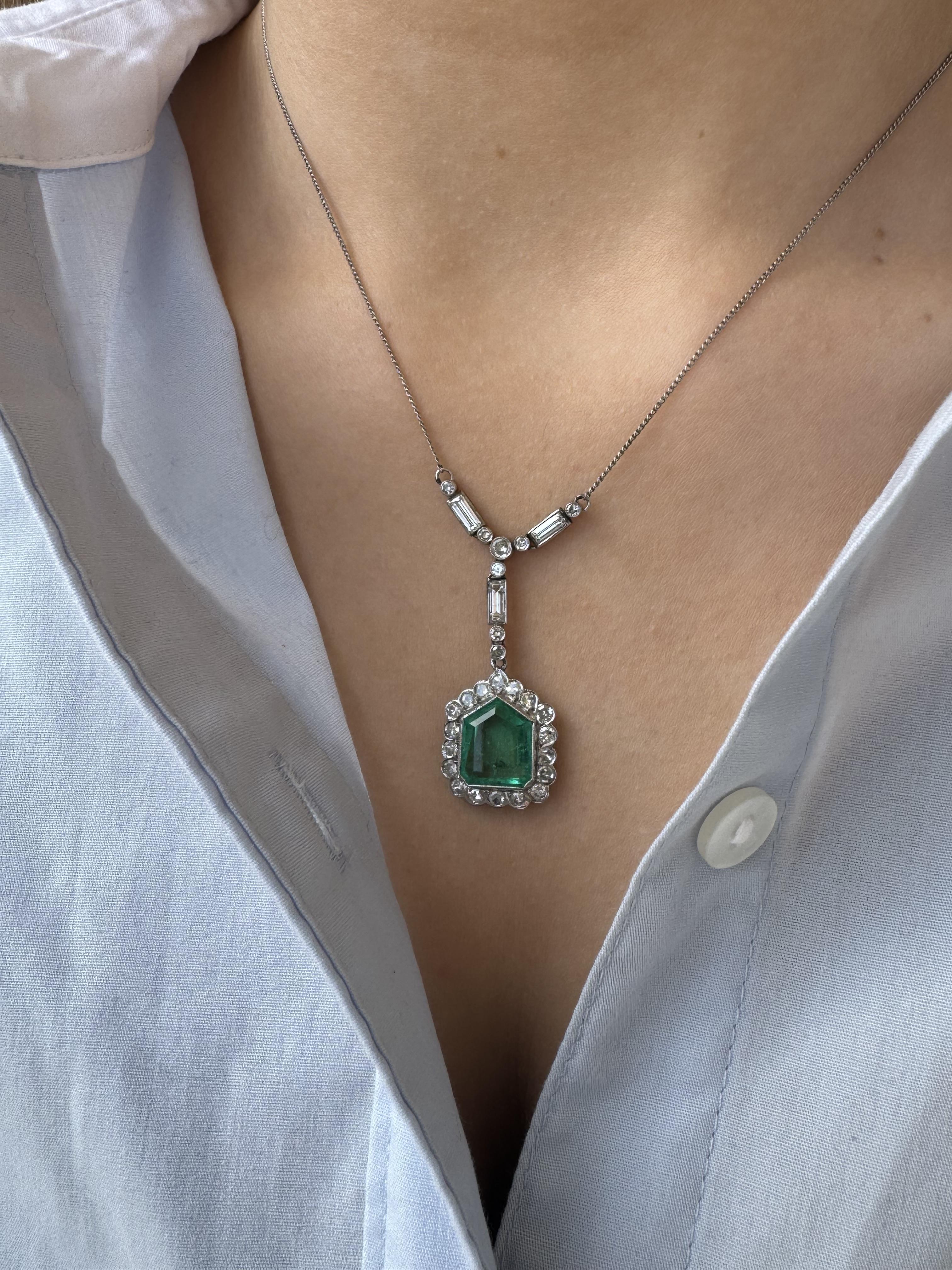 We are in absolute awe over this vintage necklace!!

Necklace Details
Material: 14K White Gold
Era: Art Deco 1920 - 1940
Chain Length: 16 Inches
Pendant Drop Length: 1 3/4 Inch
Pendant Width: 5/8 Inch
Weight: 6.6 Grams

Accented by the following