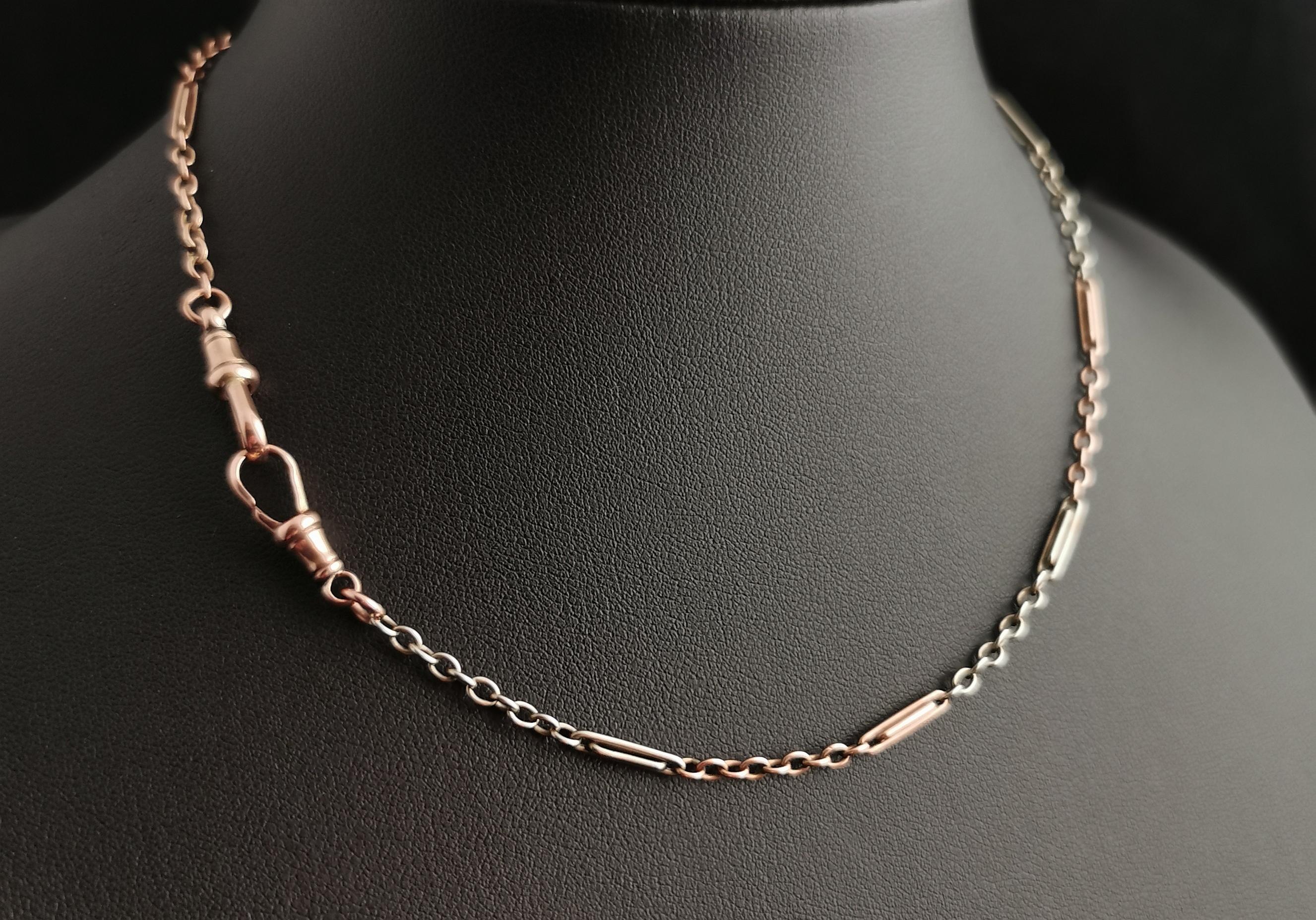 A truly stunning vintage Art Deco era fancy link Albert chain in 9kt mixed or bi colour gold.

This beautiful chain has fancy paperclip links intercepted by oval belcher links and has two colours of gold.

9kt Rose gold and 9kt white gold are used