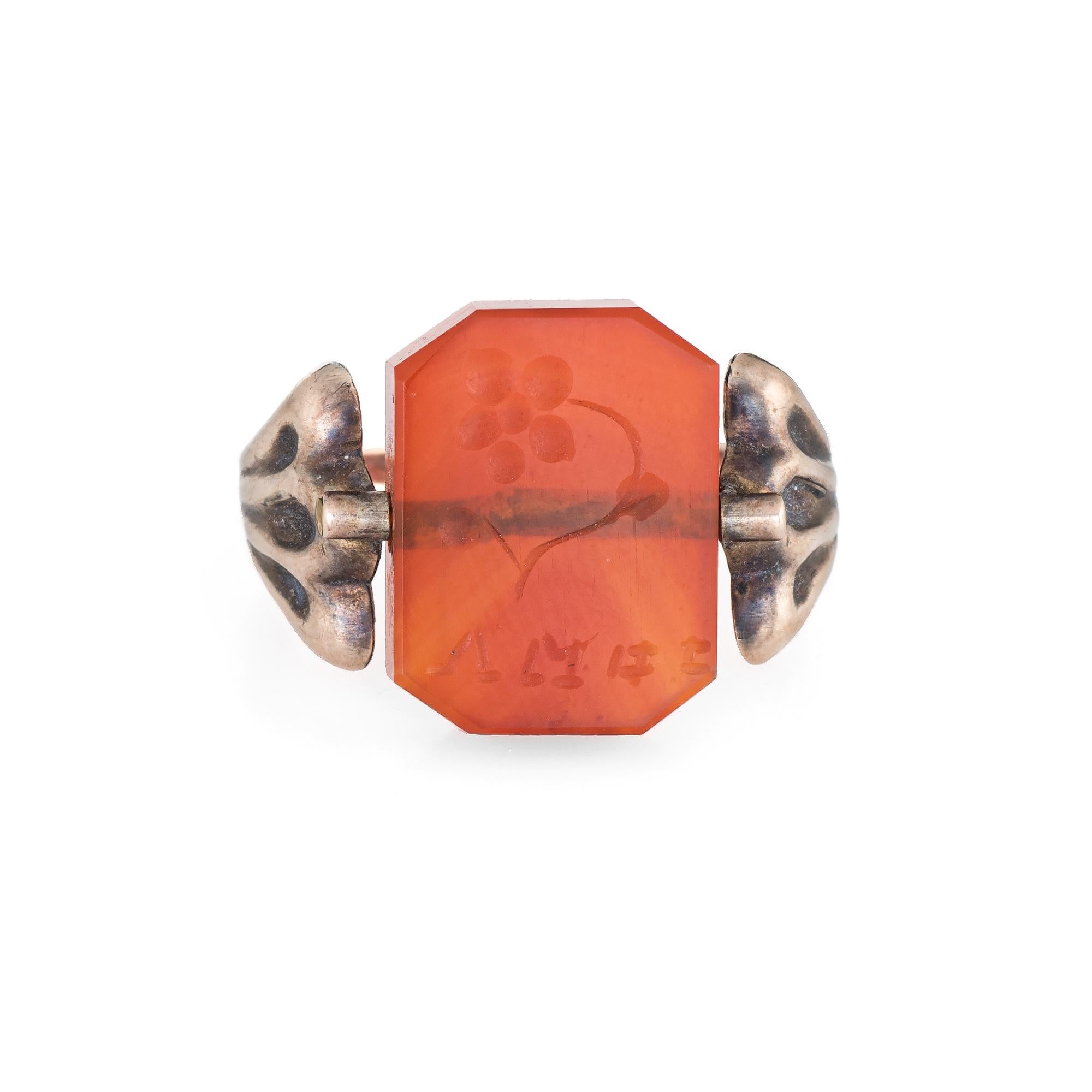 Finely detailed vintage Art Deco era ring (circa 1920s to 1930s) crafted in 10 karat rose gold. 

Carnelian measures 14mm x 11mm (in excellent condition and free of cracks or chips). 

The unique ring features a piece of carnelian etched with 