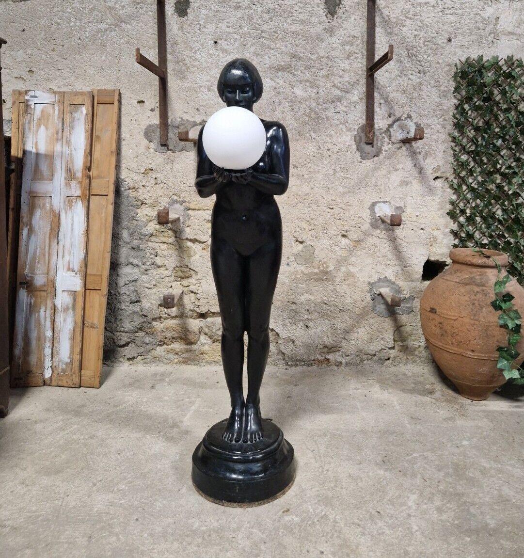 We are delighted to offer for sale this Fabulous Art Deco Floor Lamp

Nude Female holding a Ball in cupped hands
EU Wired Wiring Untested (working)
Painted in the original Black lacquer
Plaster Nude Female
Ball Shade is a later addition (replacing
