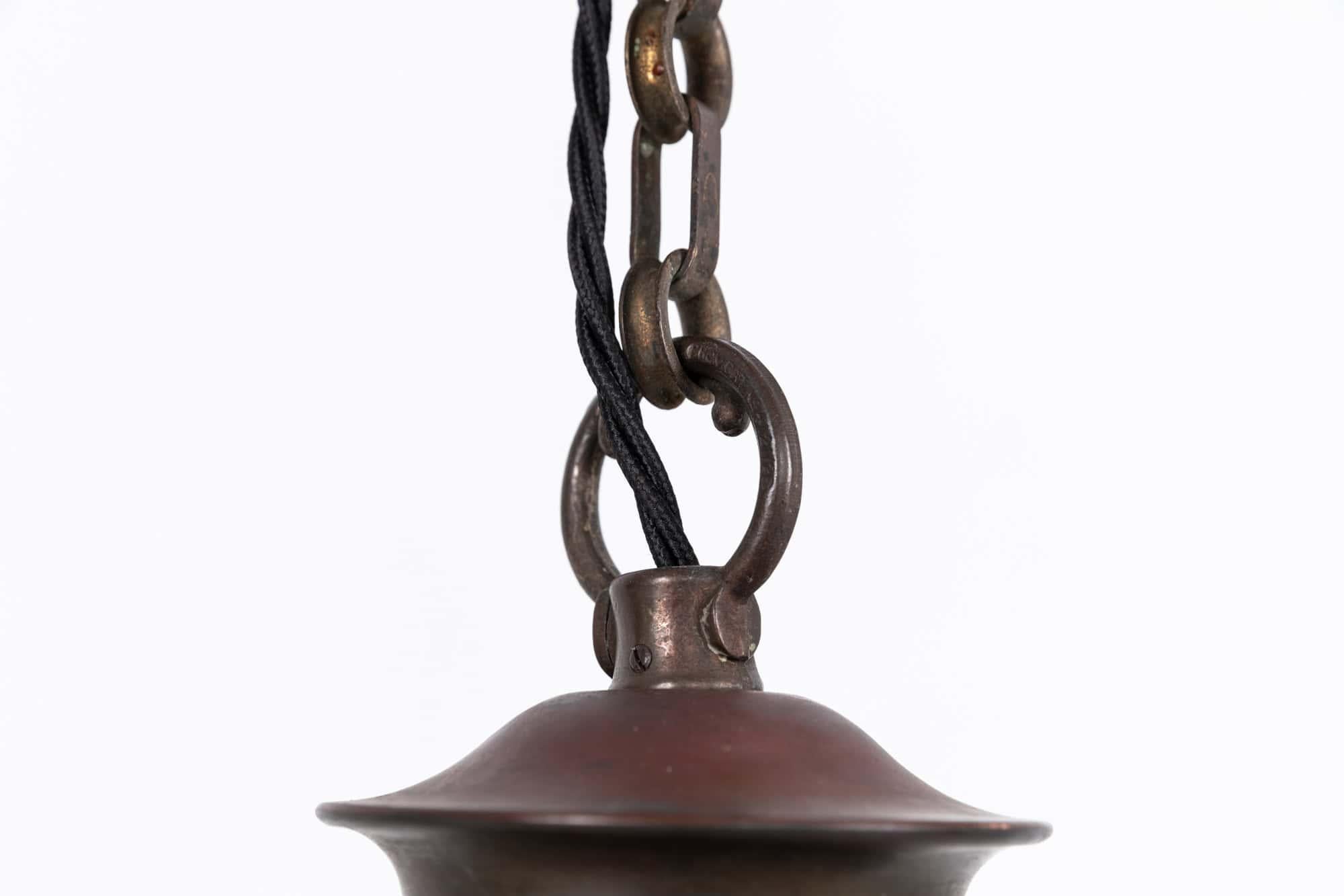 An elegantly formed globe shaped opaline glass pendant light made in England by GEC. c.1930

Hand blown and rolled white glass with original decorative GEC gallery with a beautiful time worn patina.

Rewired with black twisted flex.
