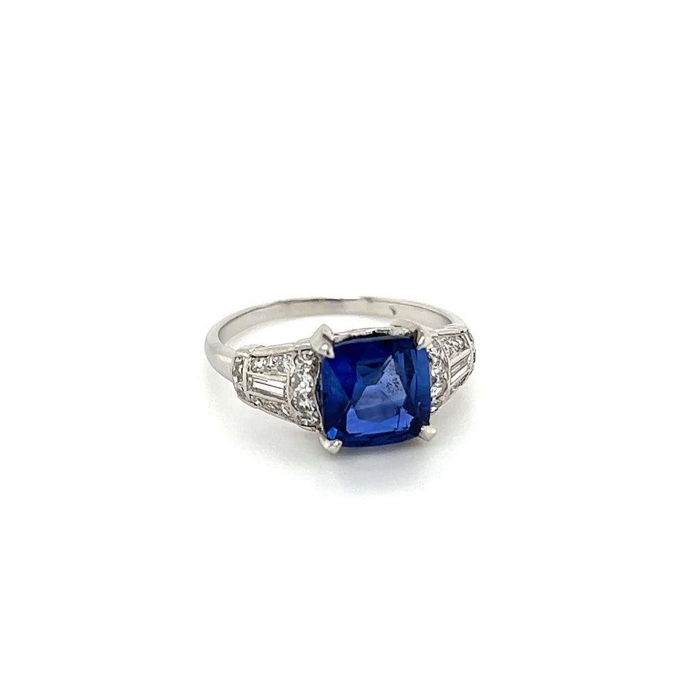Simply Beautiful! Finely detailed Cushion Ceylon Natural Blue Sapphire GIA. Centering a securely nestled Hand set 2.03 Carat Cushion Ceylon Blue Sapphire. Either side set with Baguette and Single Cut Diamonds. Hand crafted in Platinum. The Sapphire